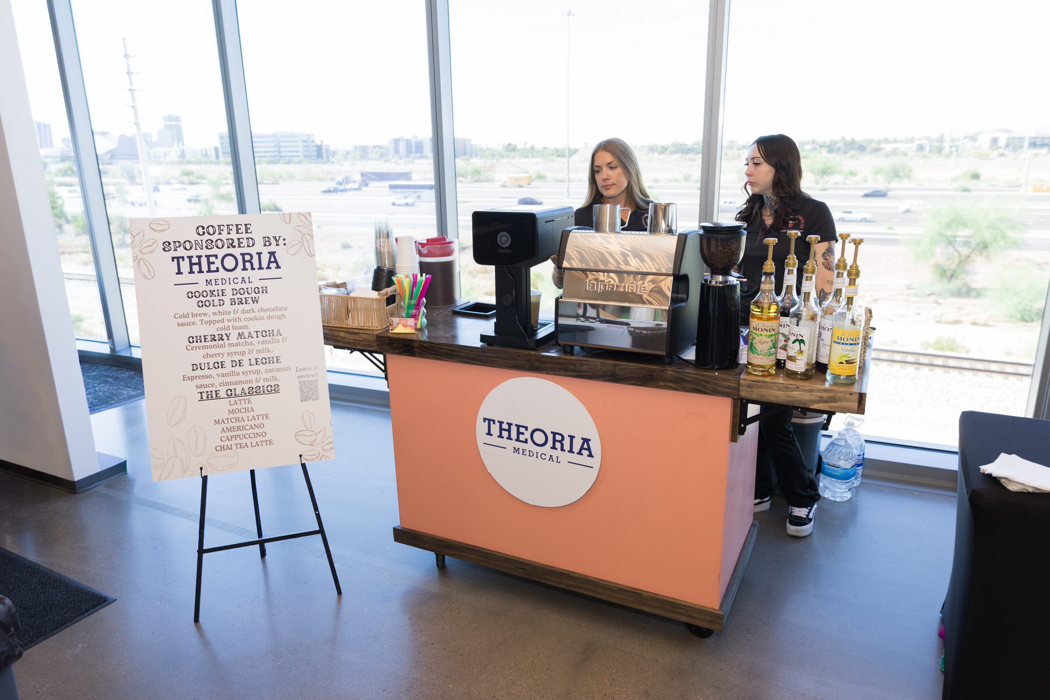 Custom branded mobile coffee cart Phoenix corporate event Theoria Medical