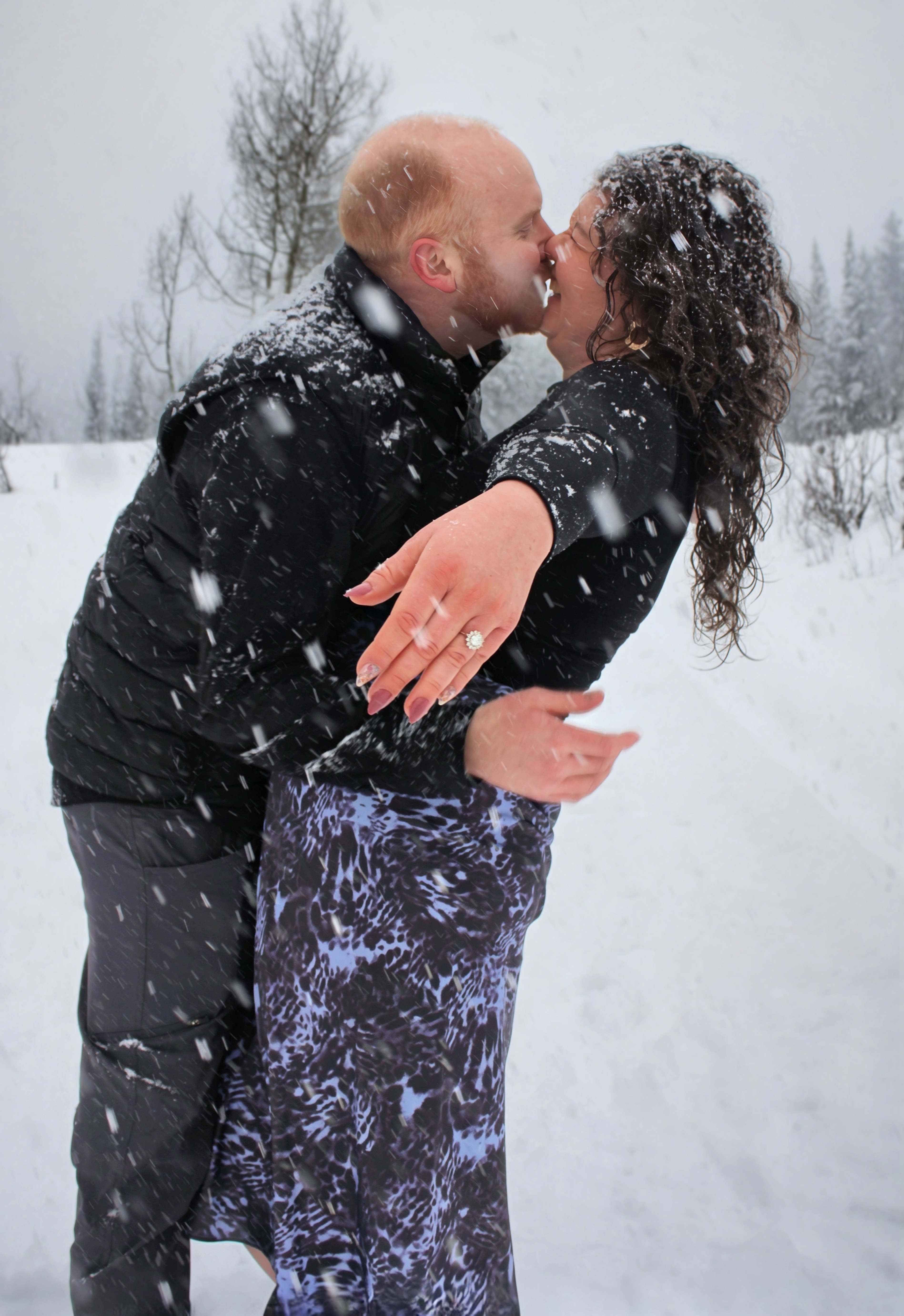 Sydney & Bryan kissing in the snow