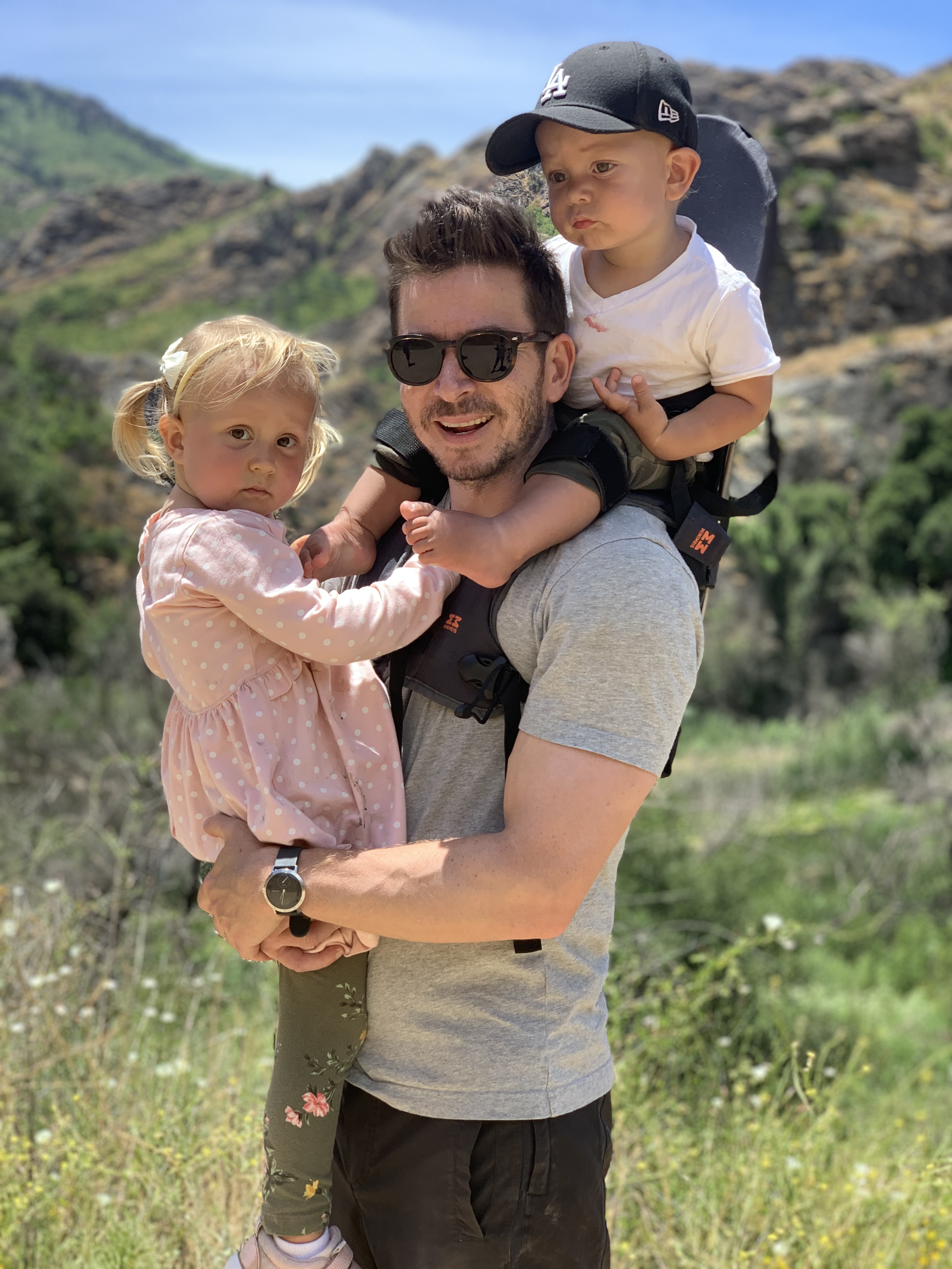 David with his kids hiking in the mountains