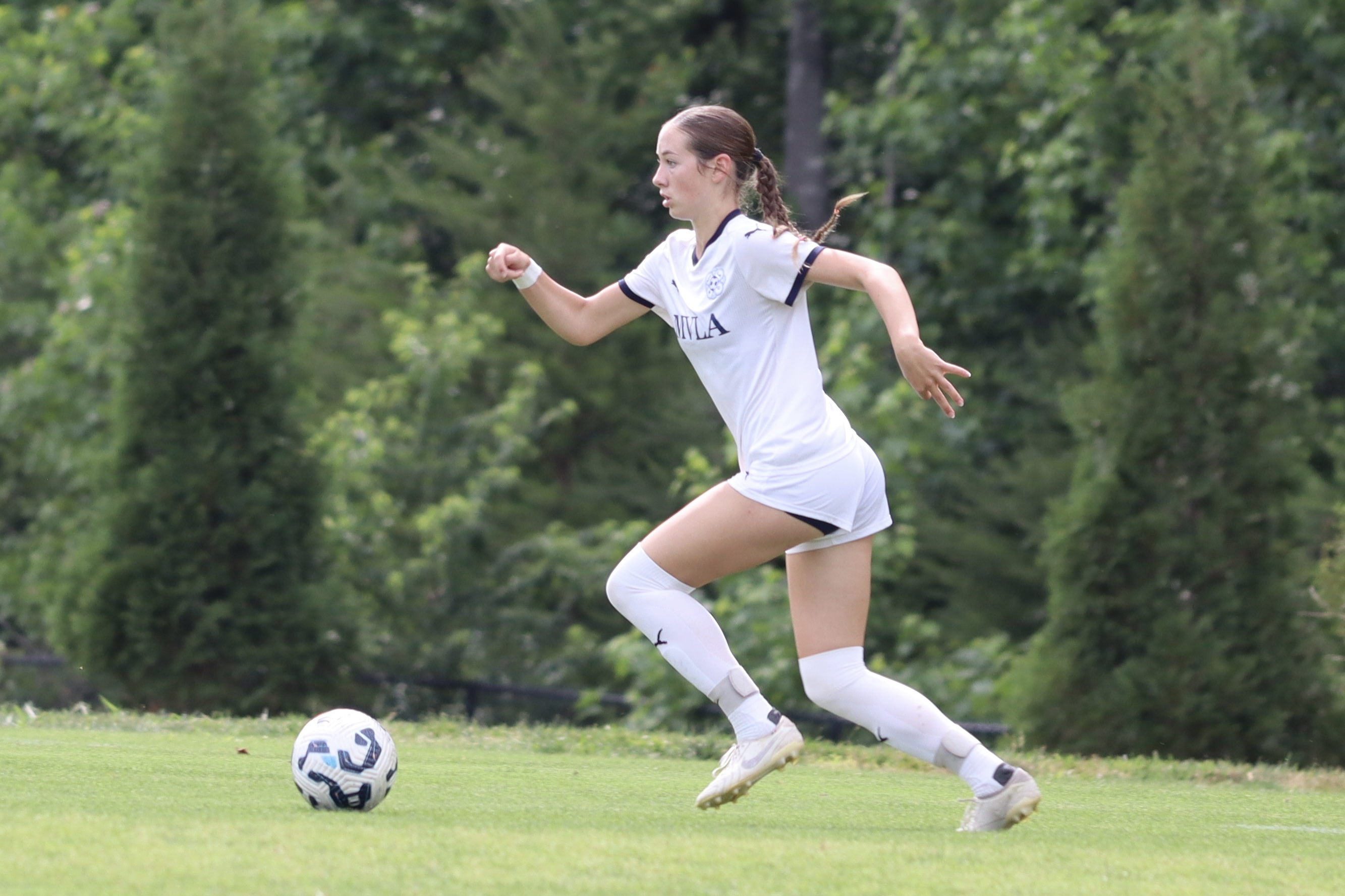 Player dribbling up the field