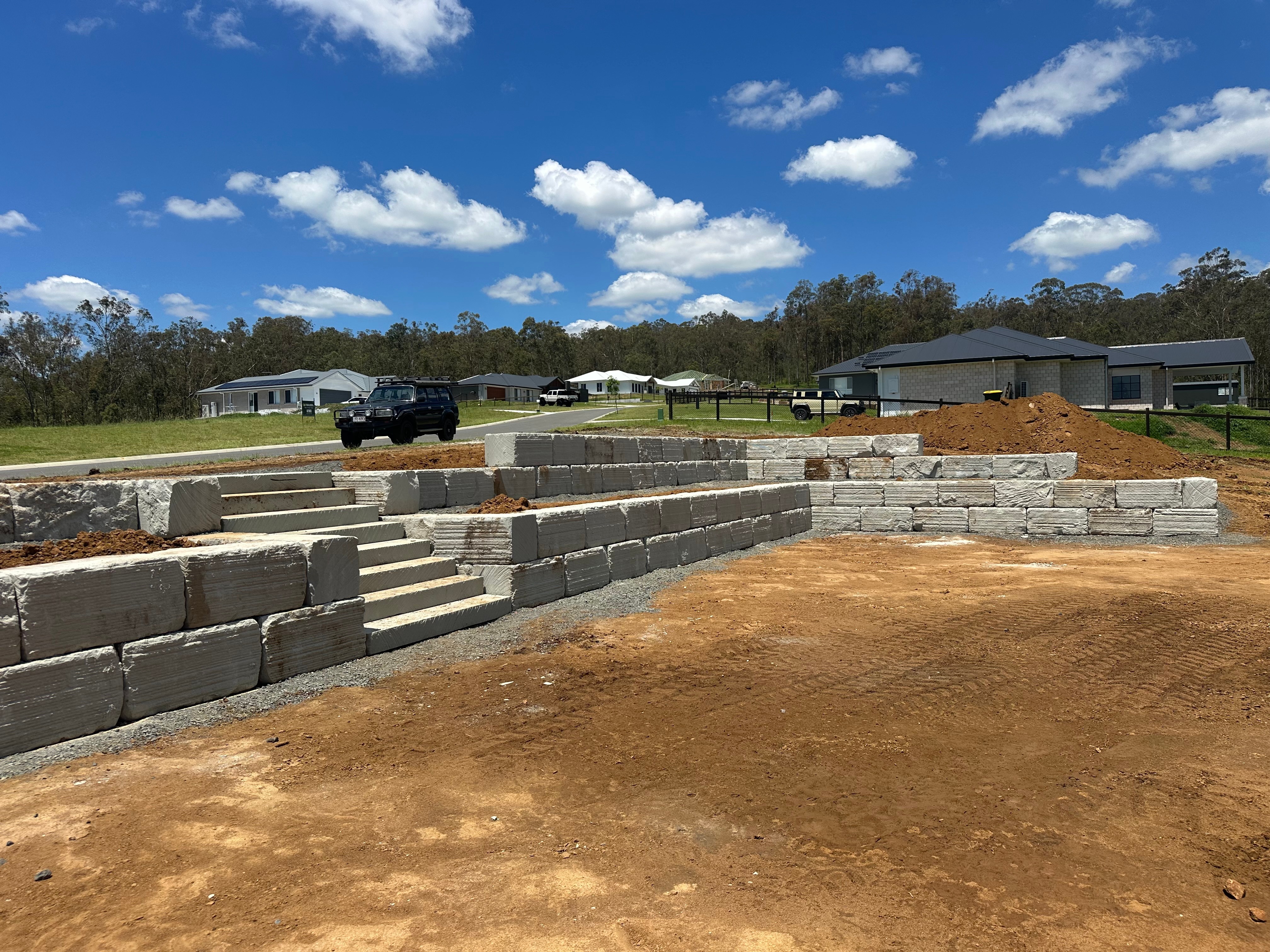 Concrete sleeper retaining wall in residential estate