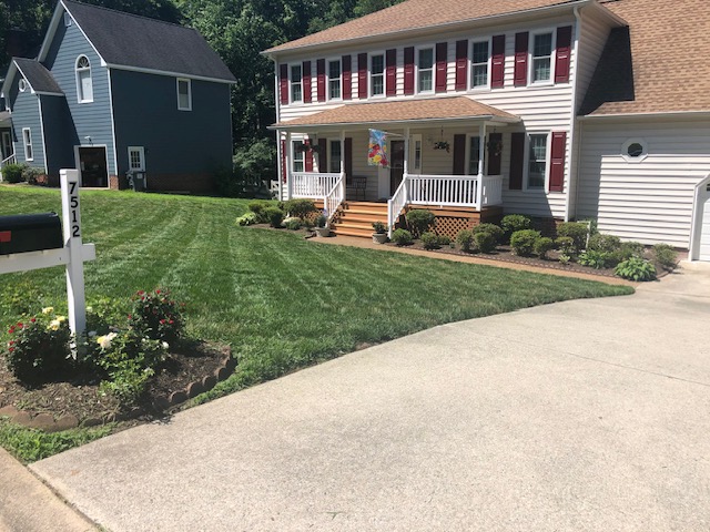 Beautiful residential property showcasing our professional lawn care