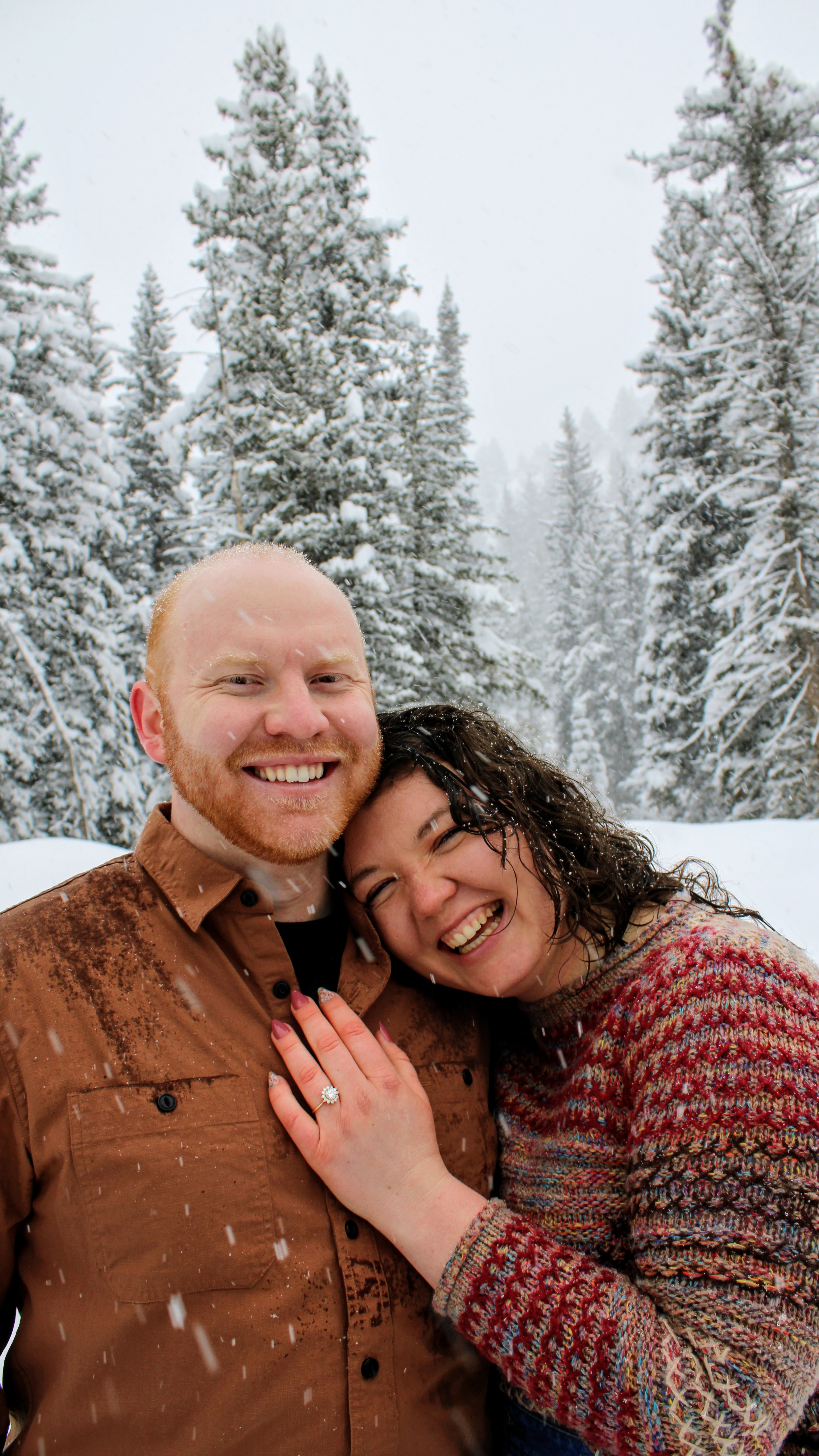 Sydney & Bryan engagement photo in snowy forest