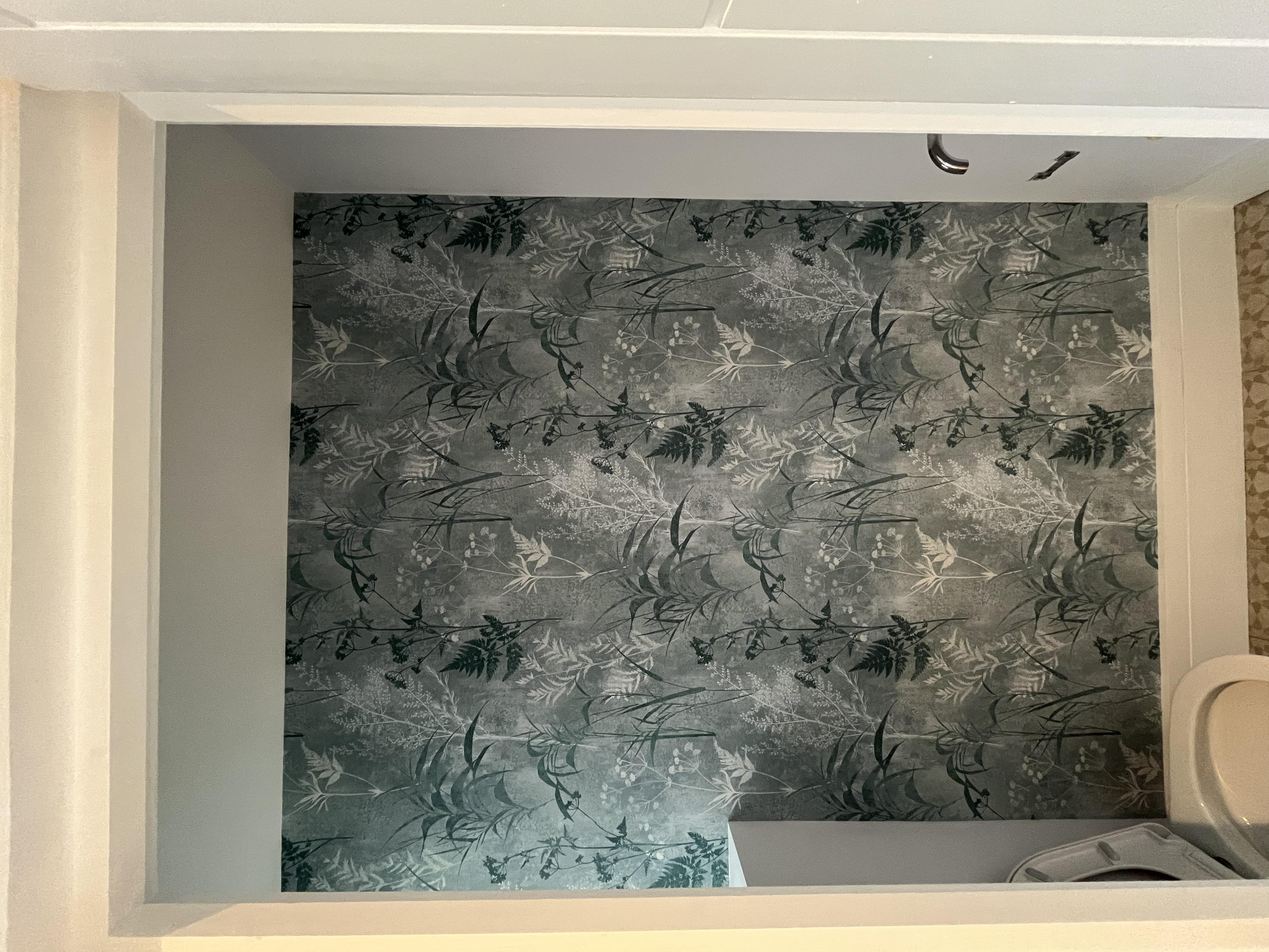 WC with coordinating botanical wallpaper