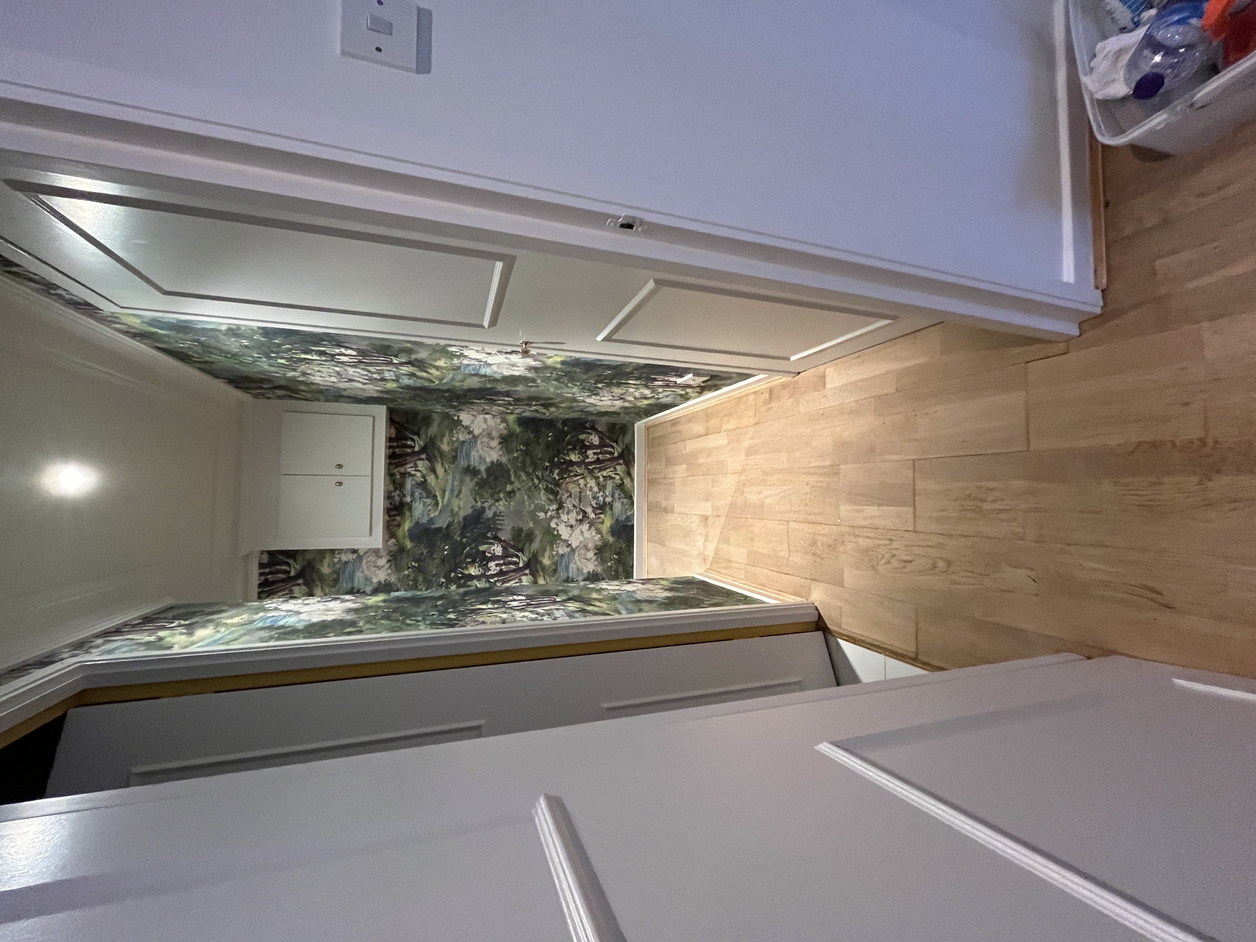 Corridor with sanded oak flooring and feature wallpaper