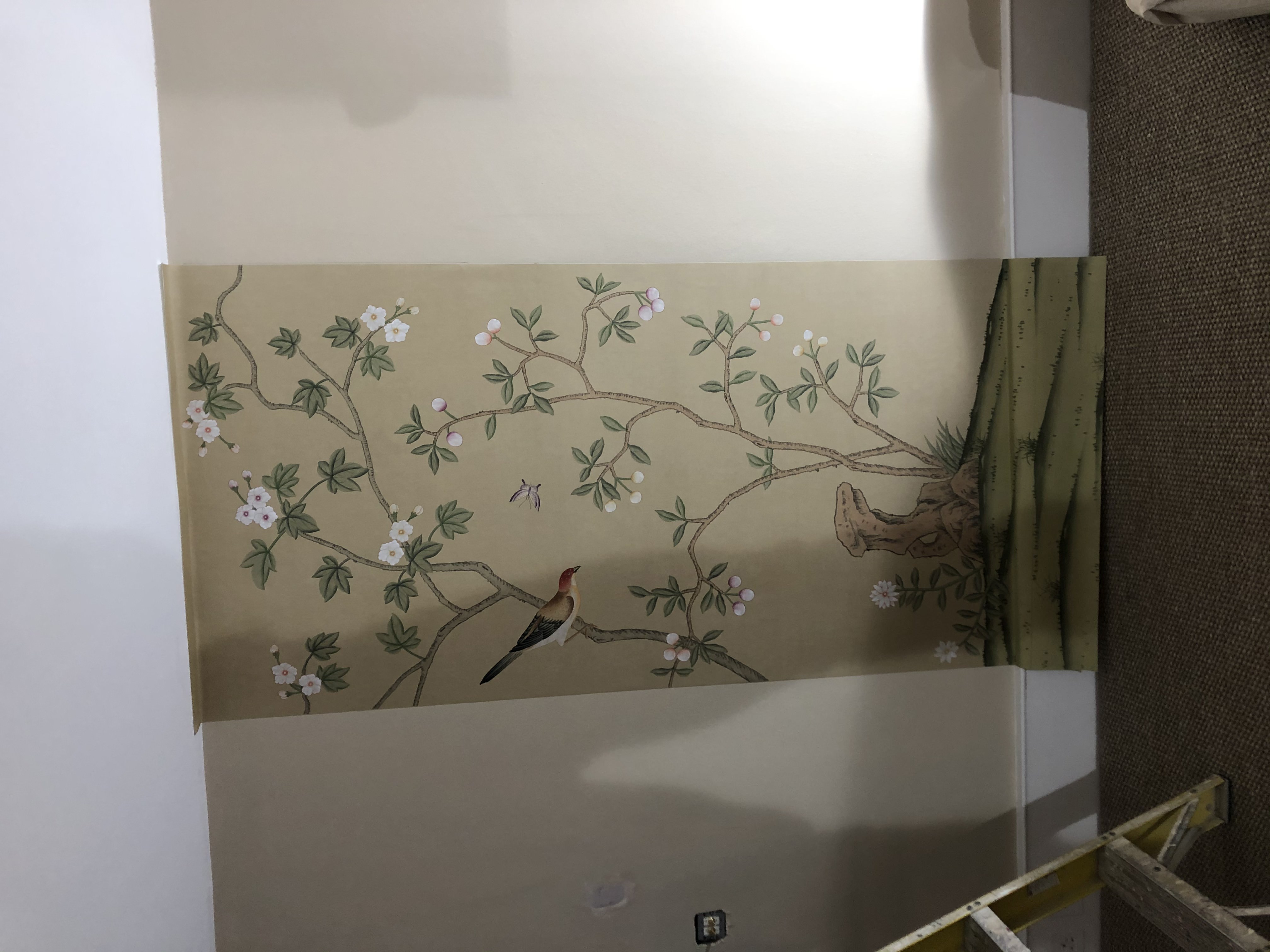 Chinoiserie mural panel being installed