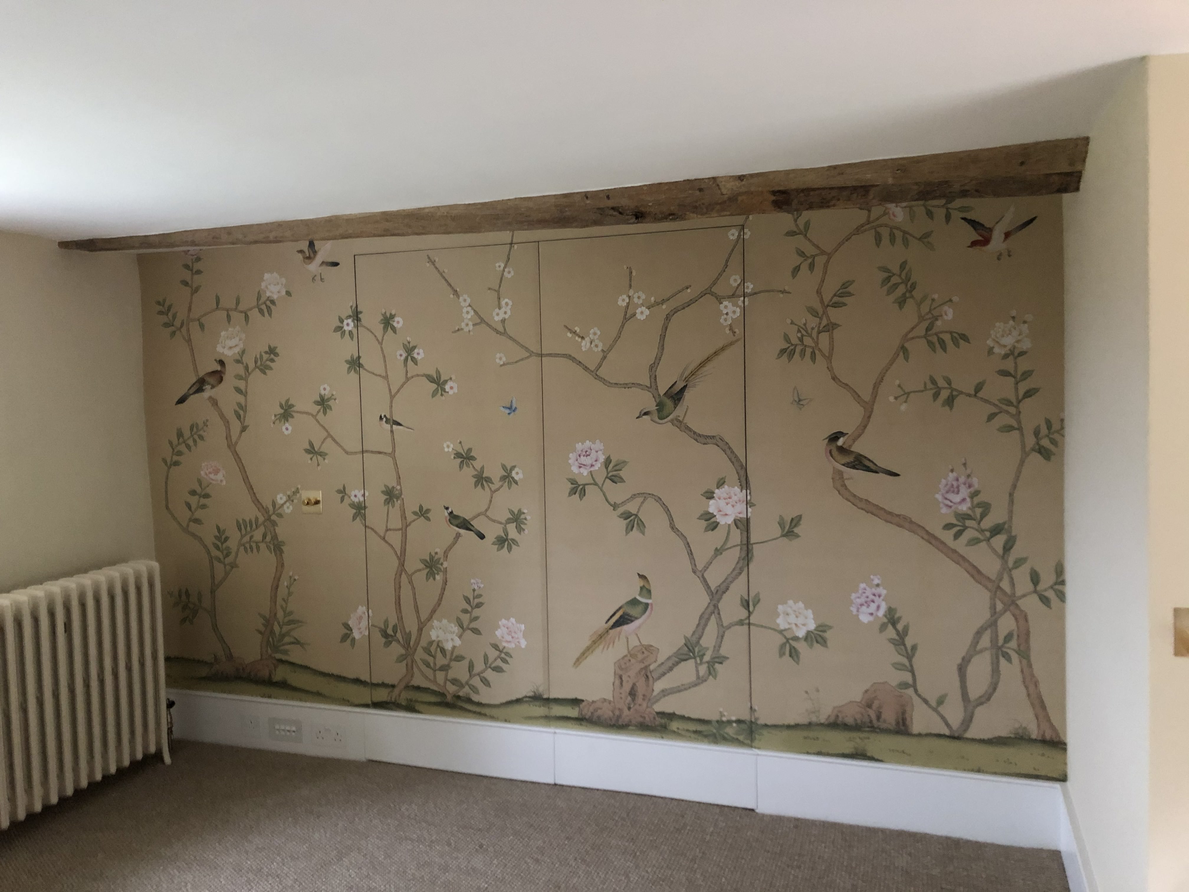 Completed chinoiserie mural with exposed beam