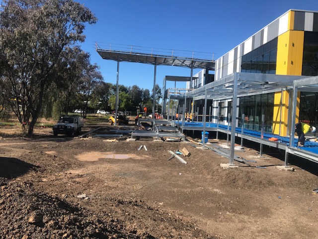 Steel framing and glazing installation at a commercial building