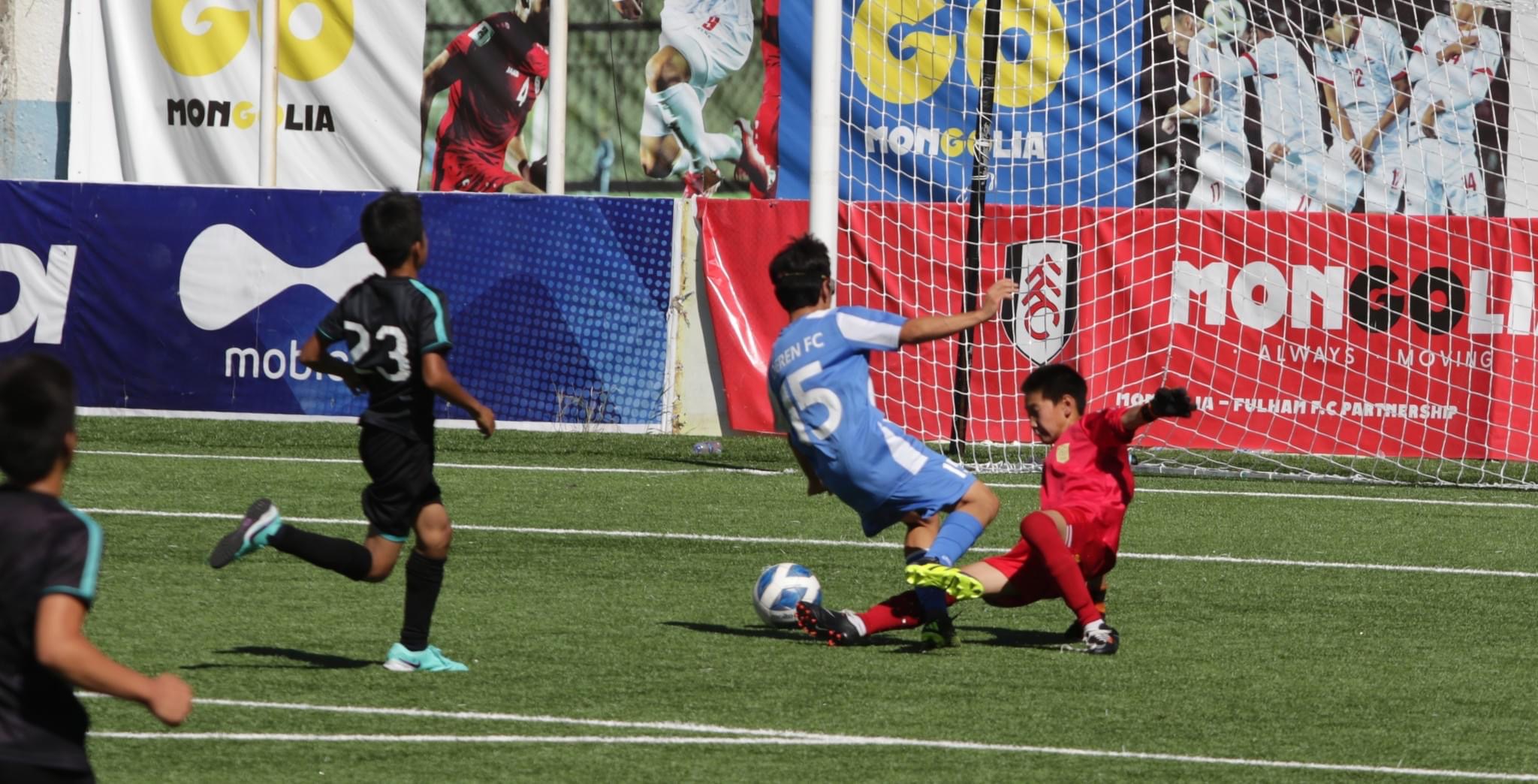 Erkhembold scoring past goalkeeper