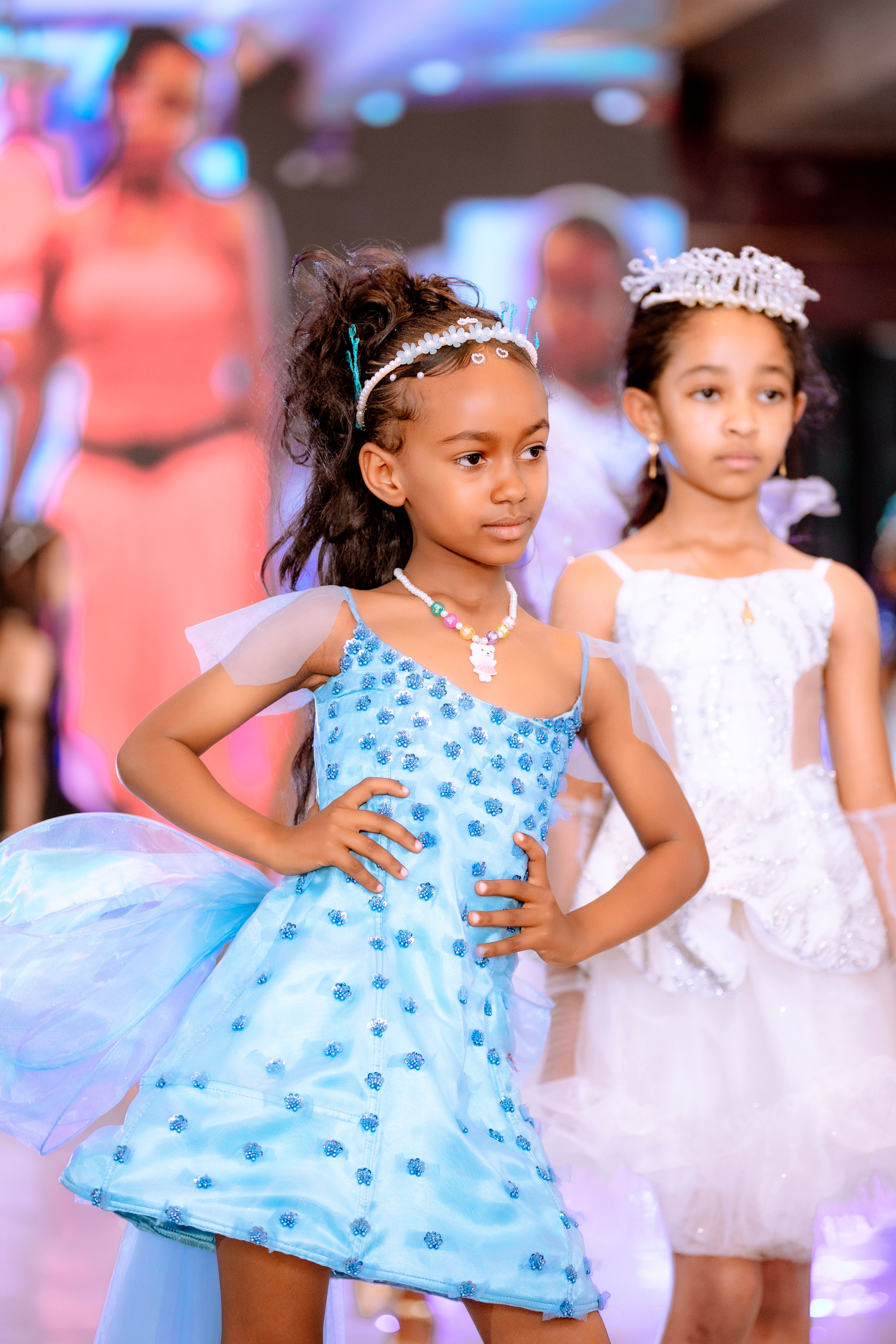 Model in a bright blue embellished dress