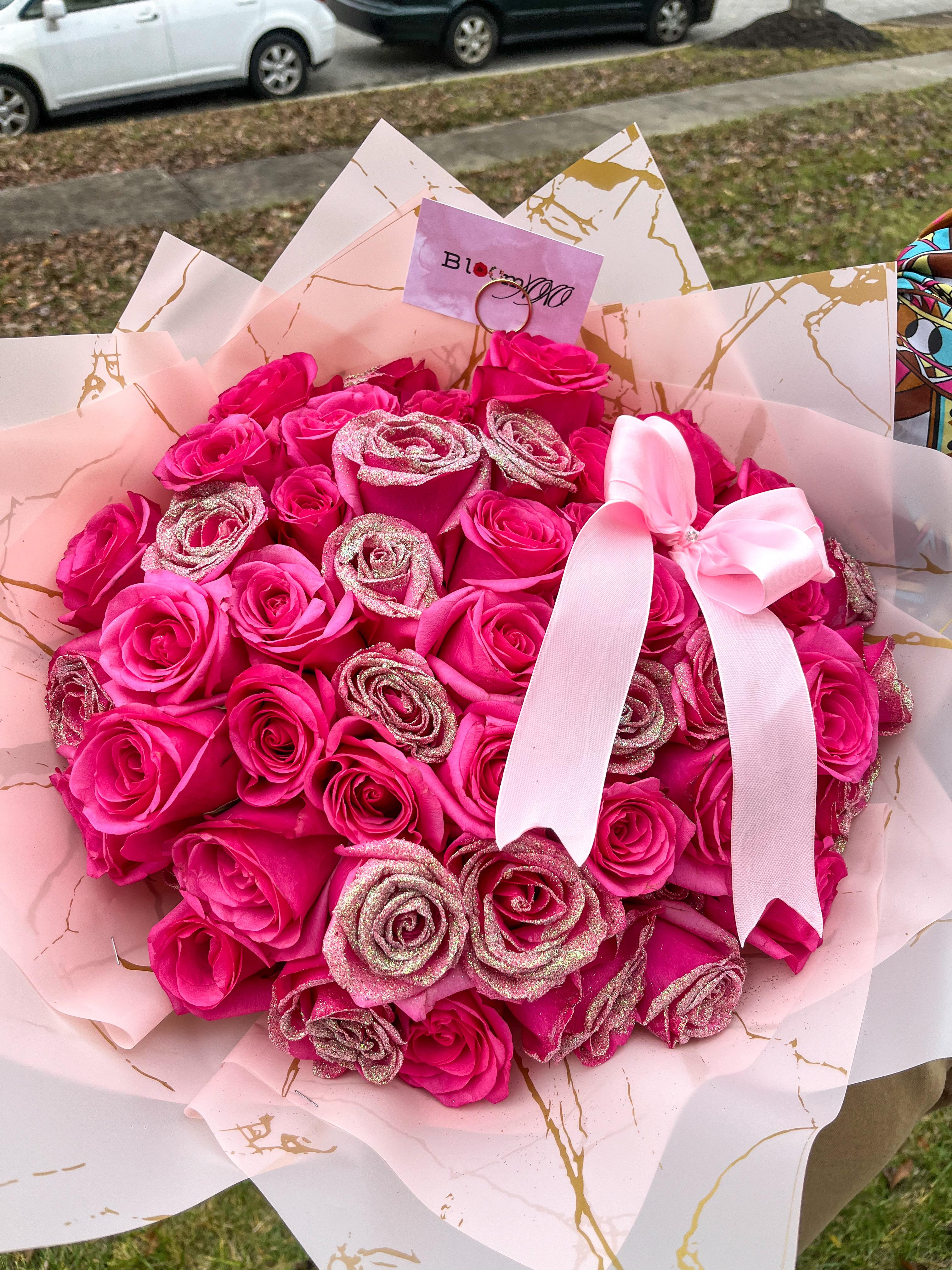 Hot pink roses with glitter in pink wrapping