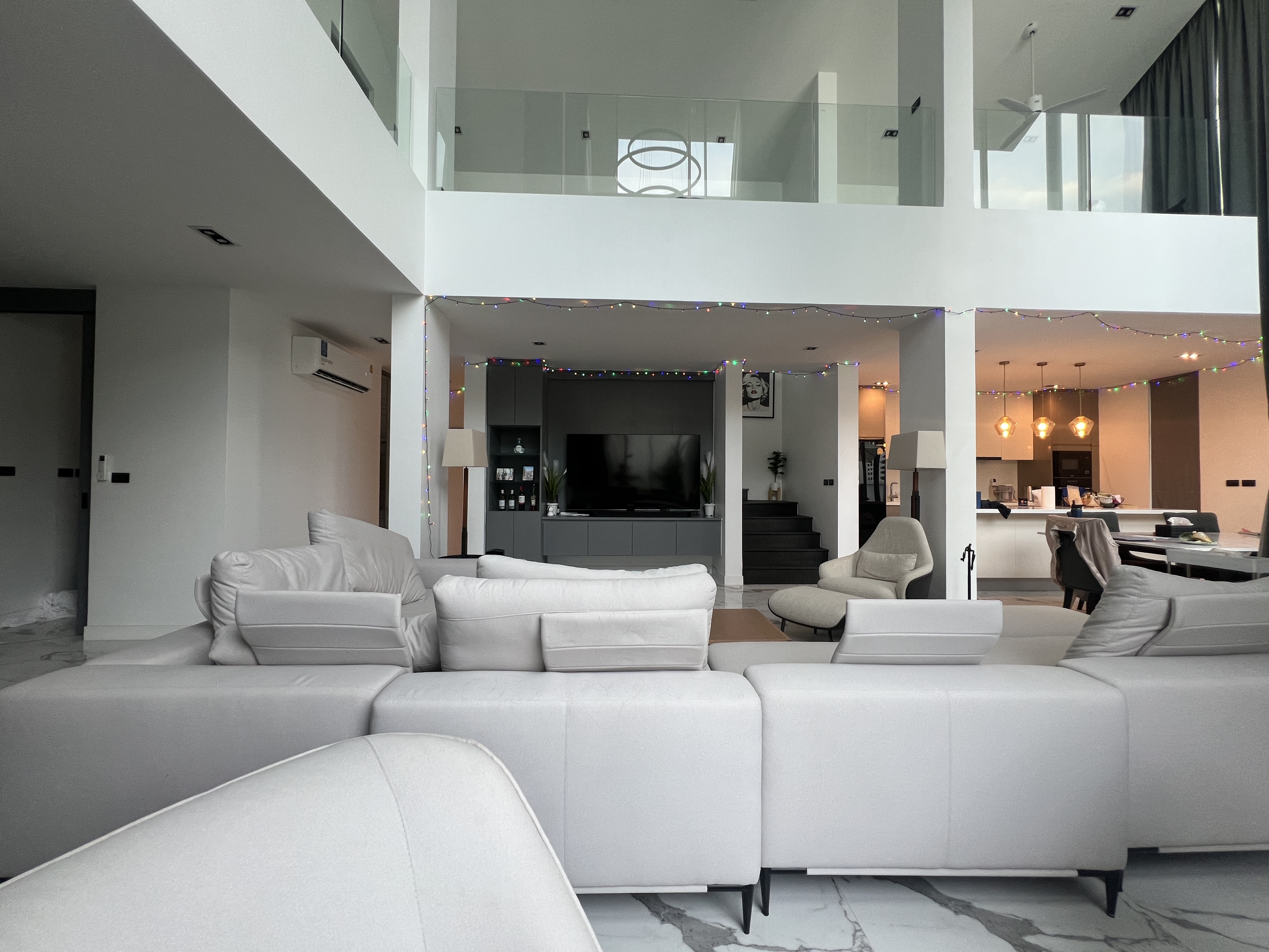 Modern living room with double-height ceiling