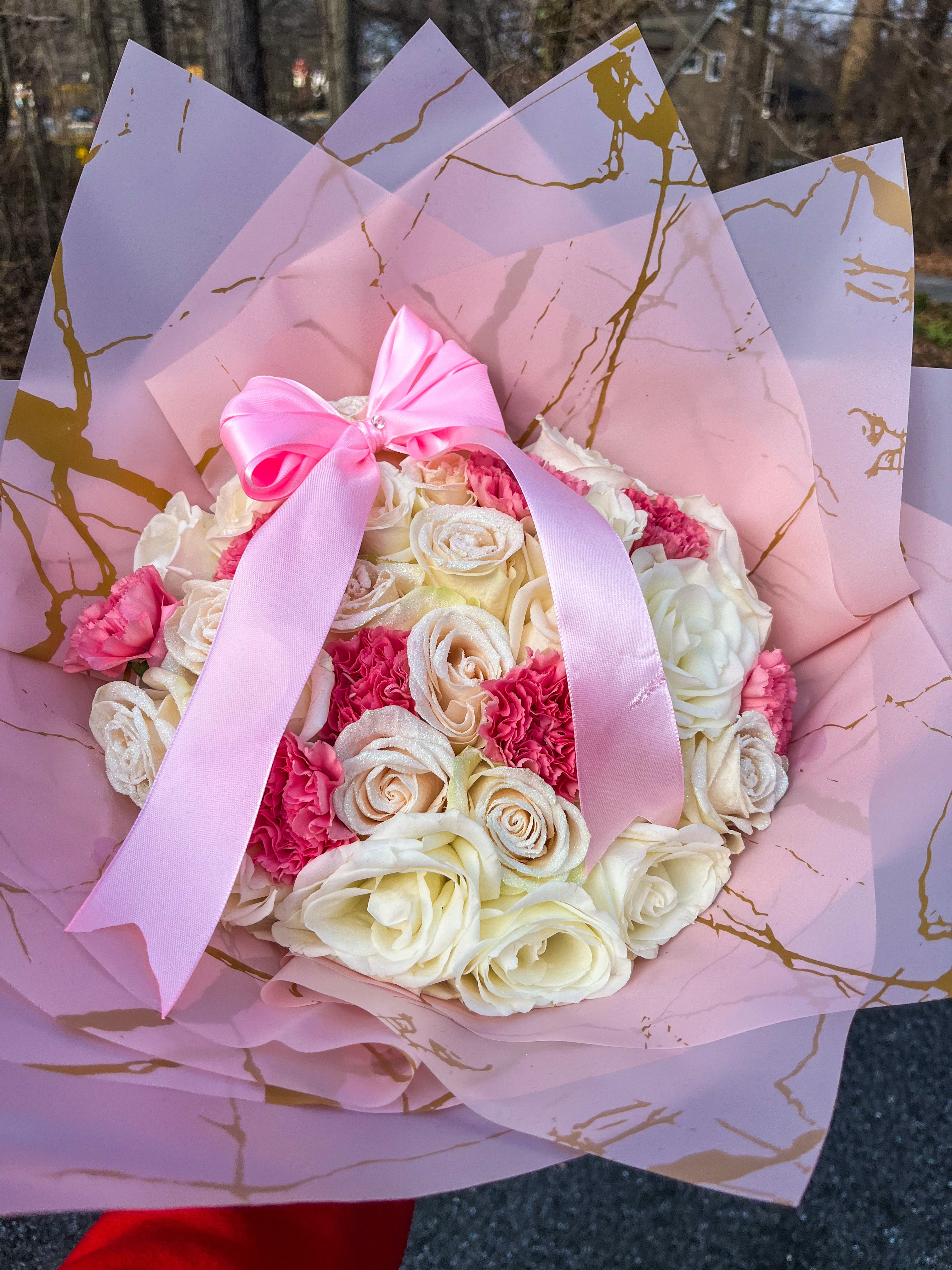 White and pink roses with large pink bow