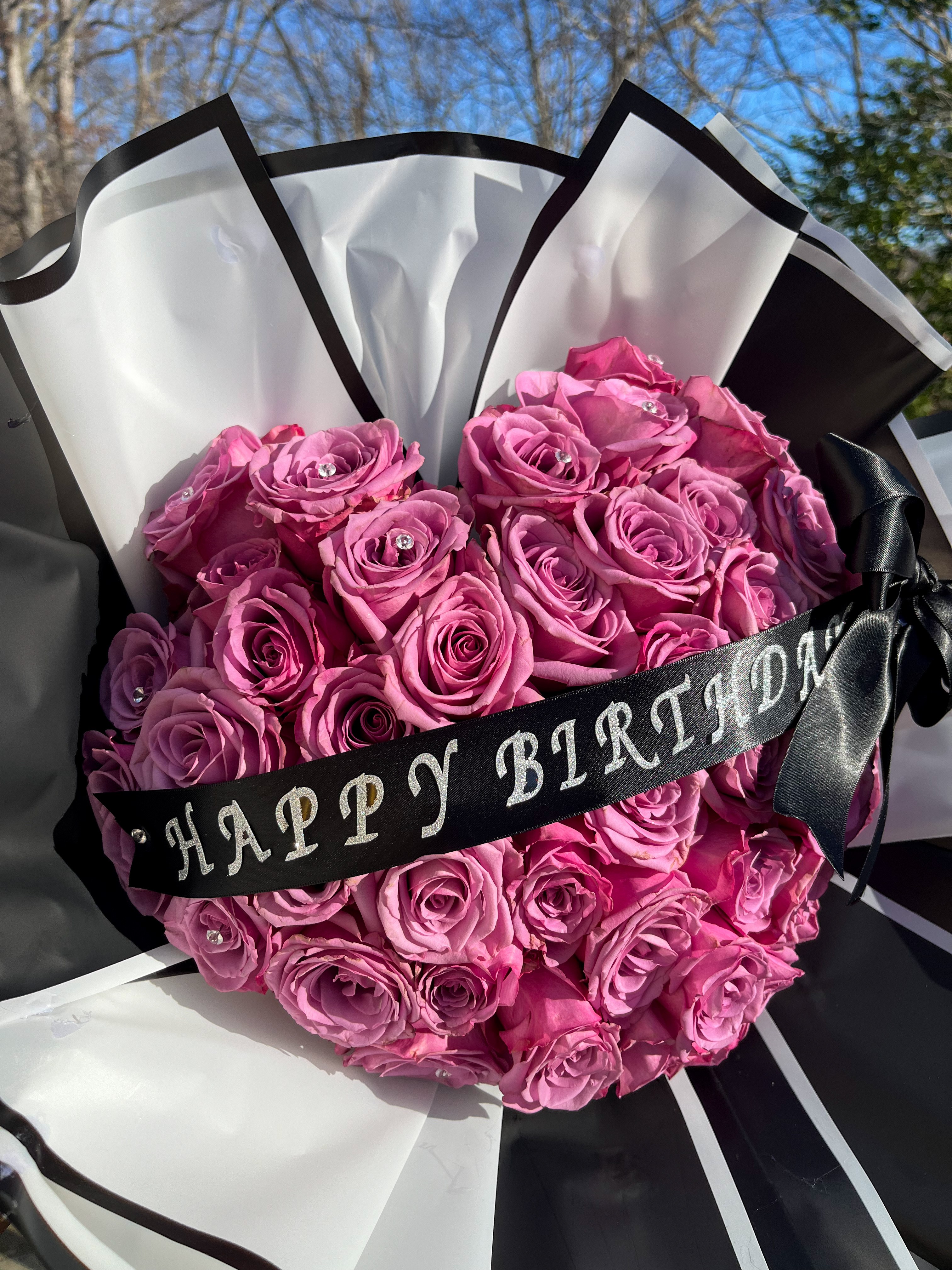 Mauve roses with Happy Birthday ribbon
