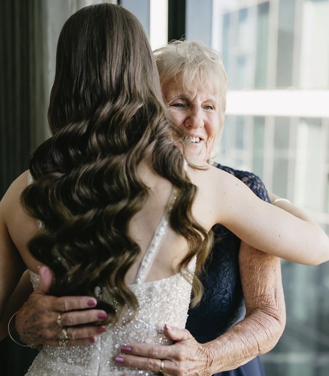 Bride with grandmother in emotional moment