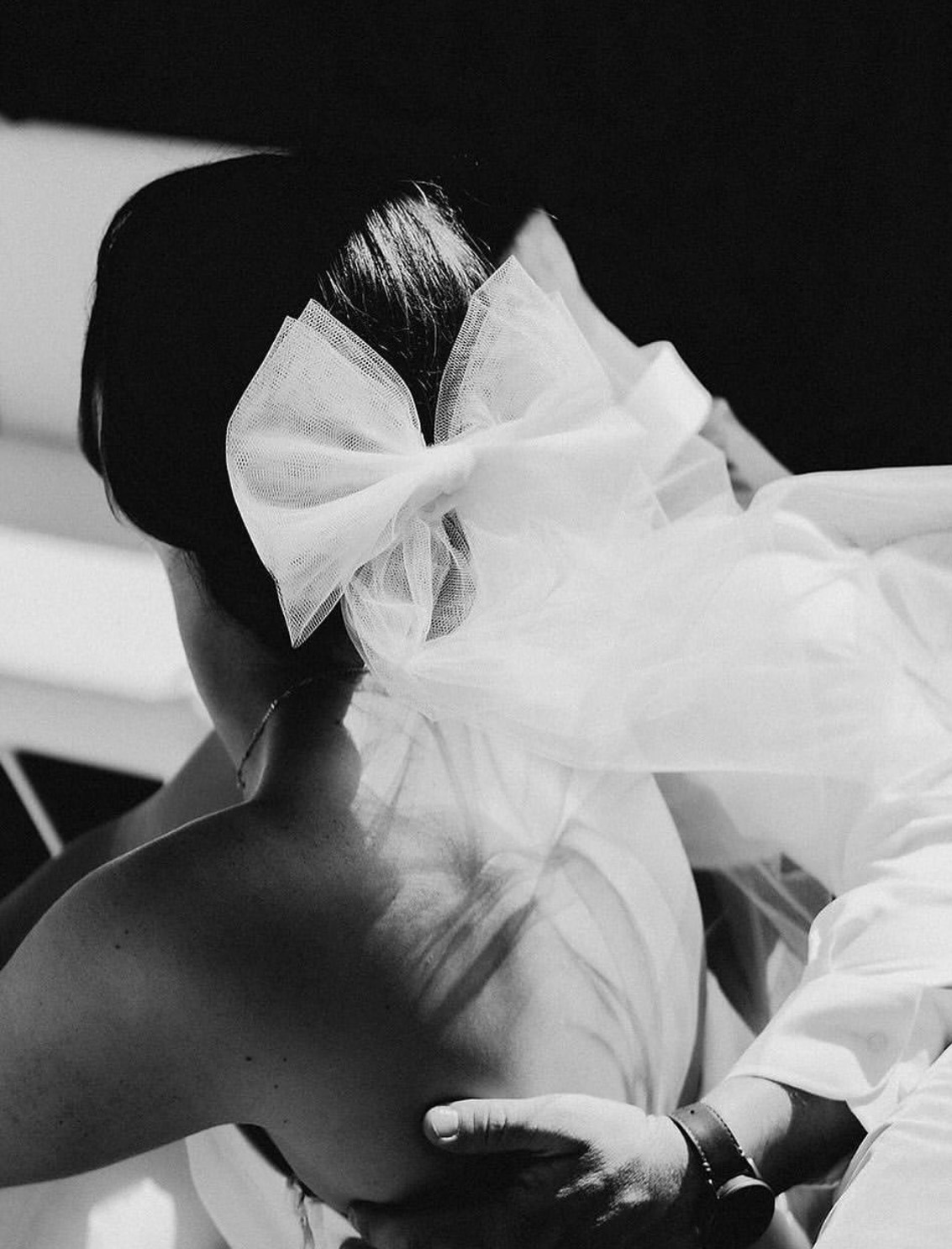 Bridal hair detail with tulle bow