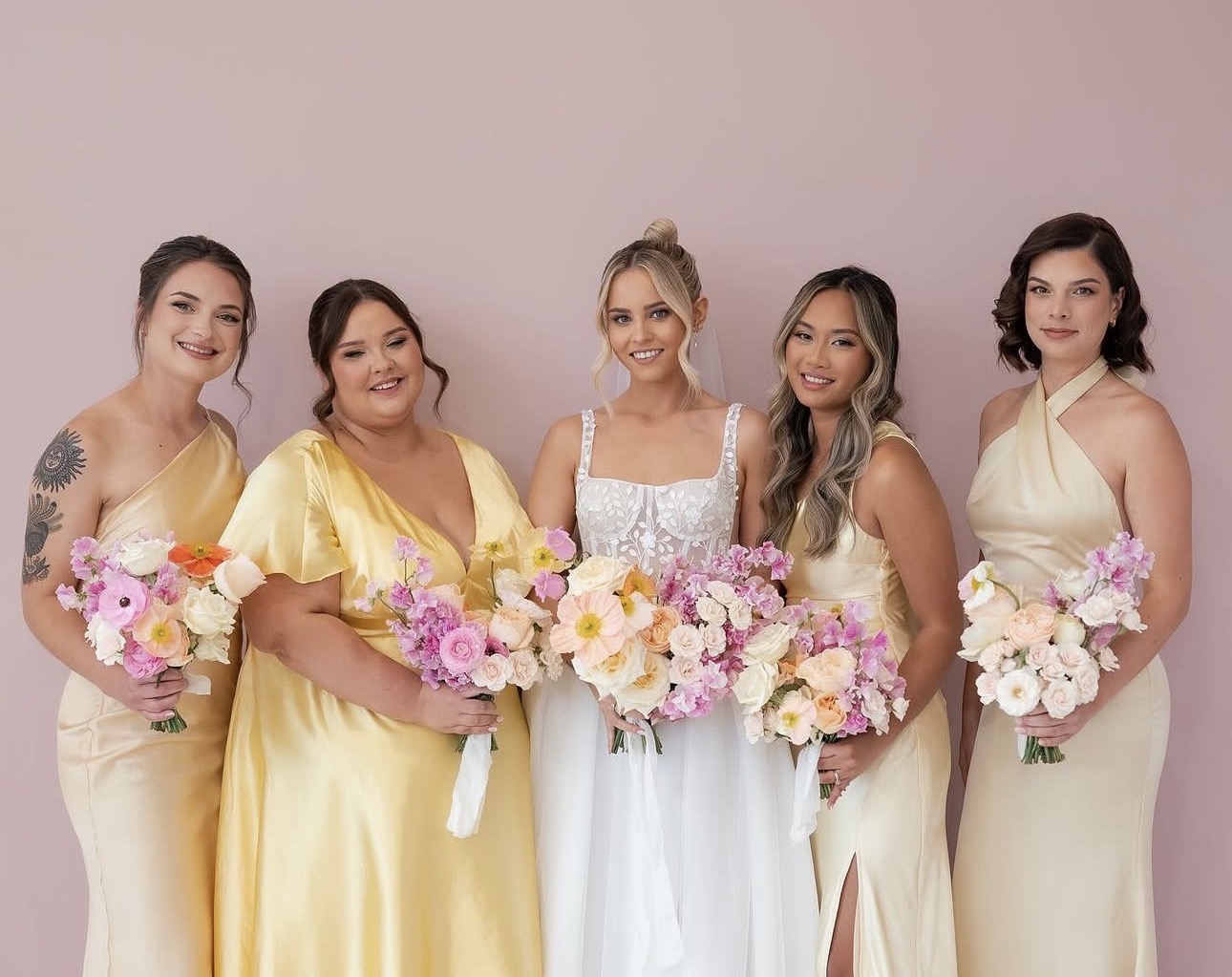 Bride with bridesmaids in yellow dresses