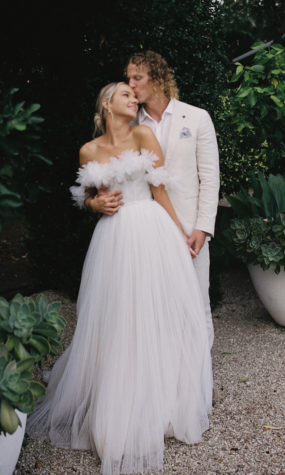 Bride and groom in garden setting