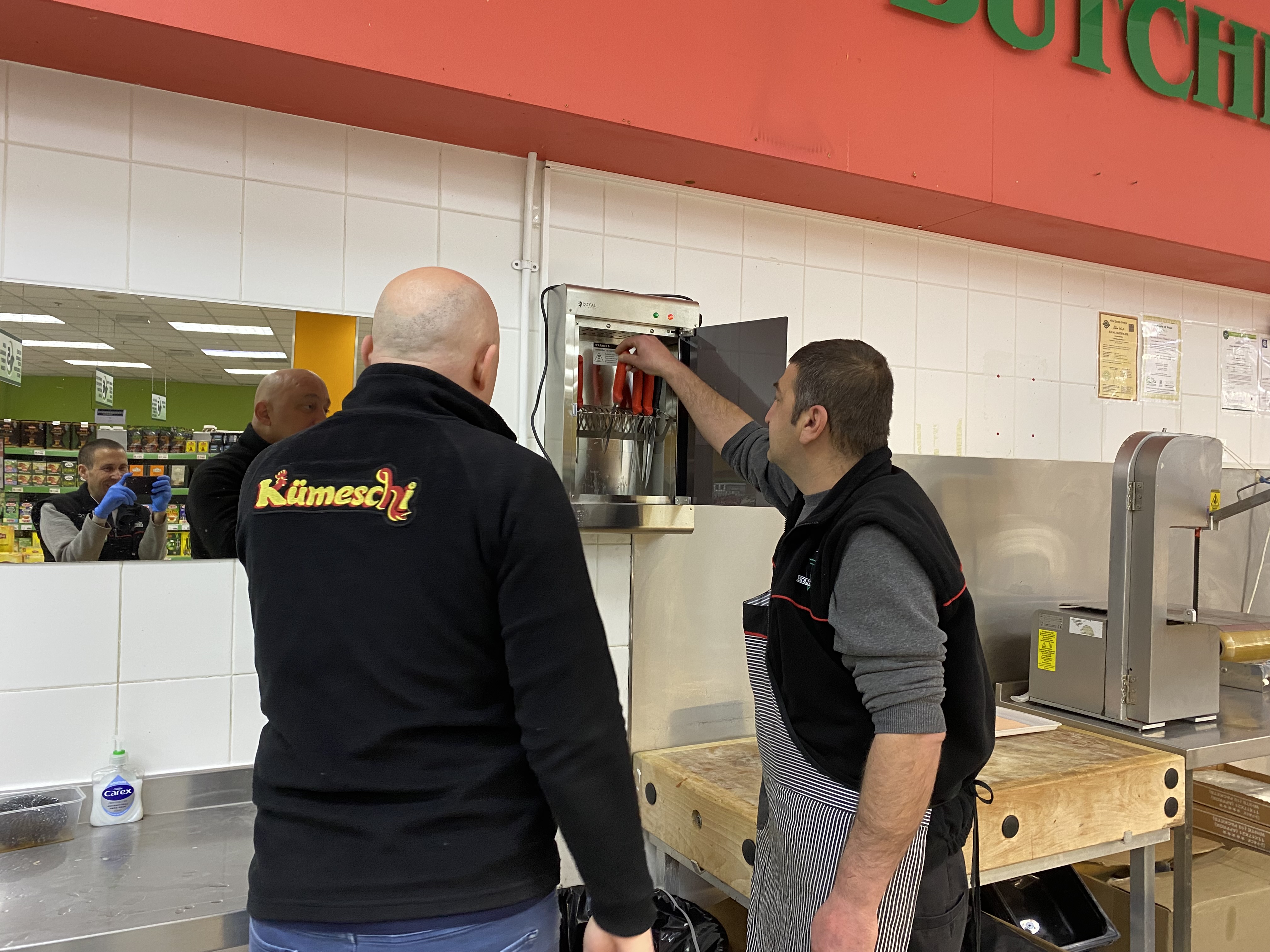 Equipment training at butcher shop