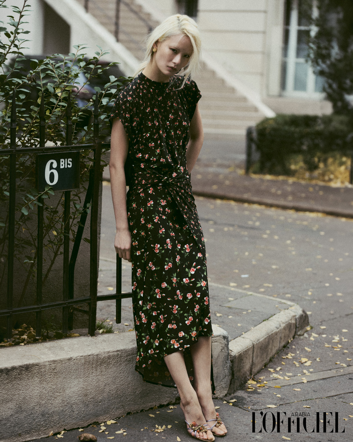L'Officiel Arabia editorial — blonde model in a black floral dress