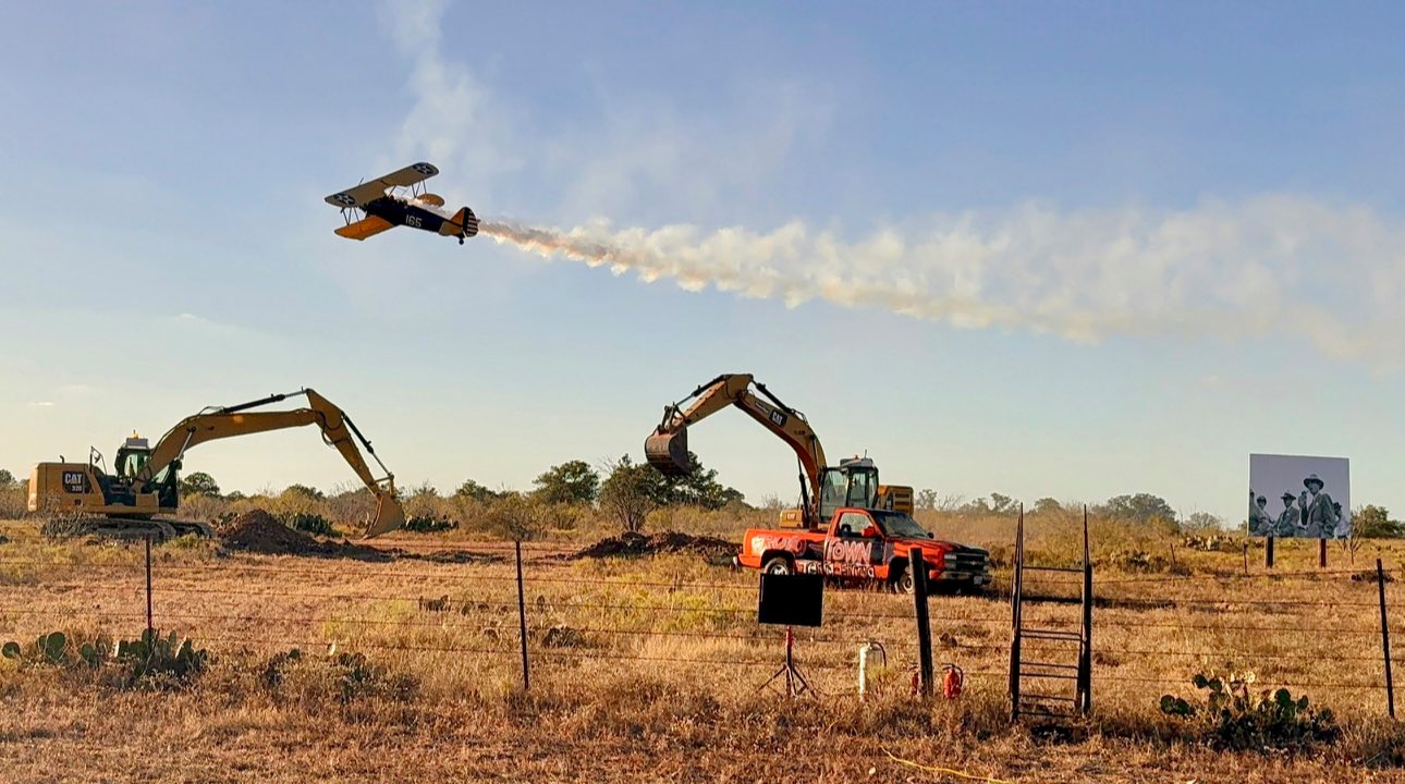 Vintage aircraft and excavators demonstration