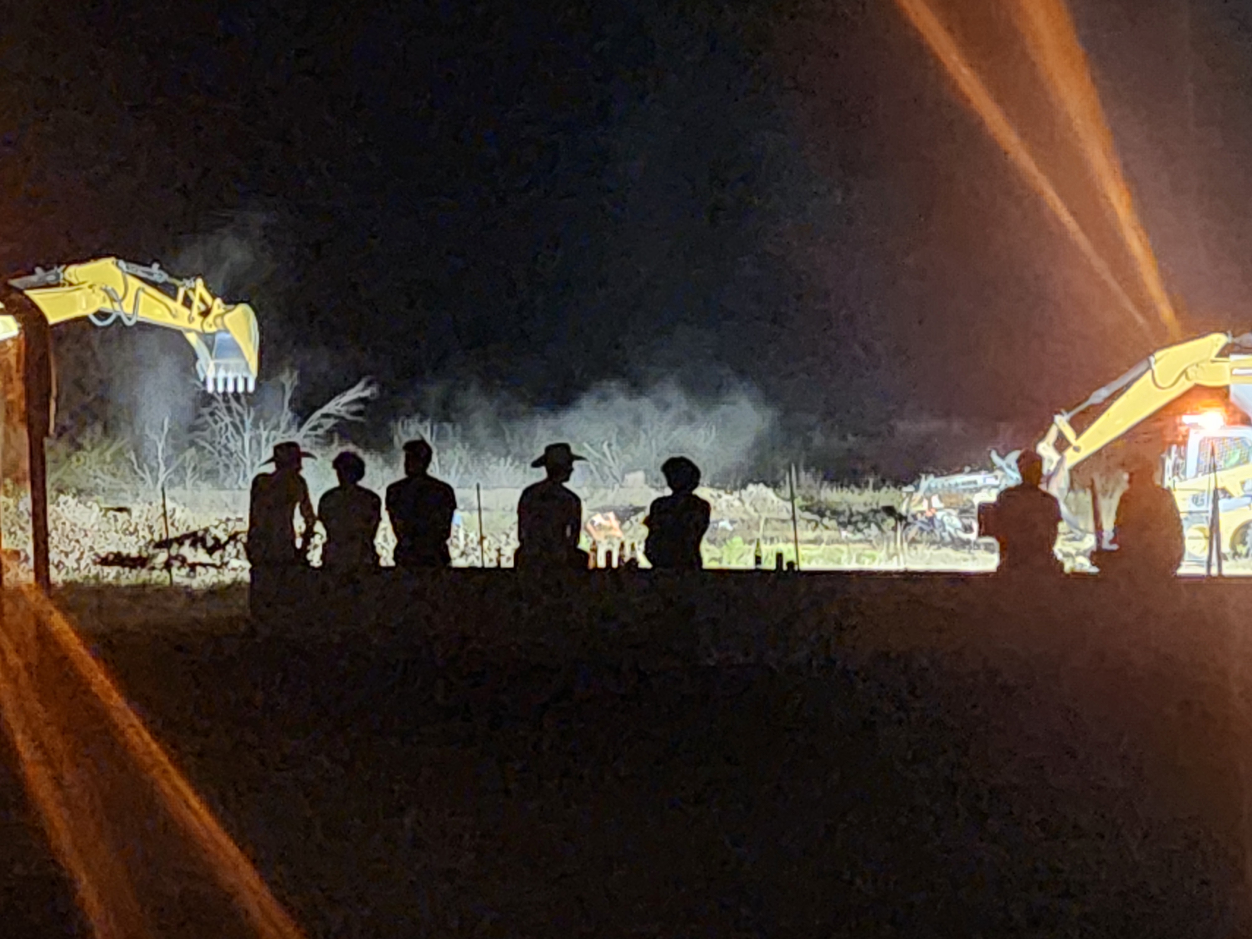 Night demonstration with silhouetted attendees