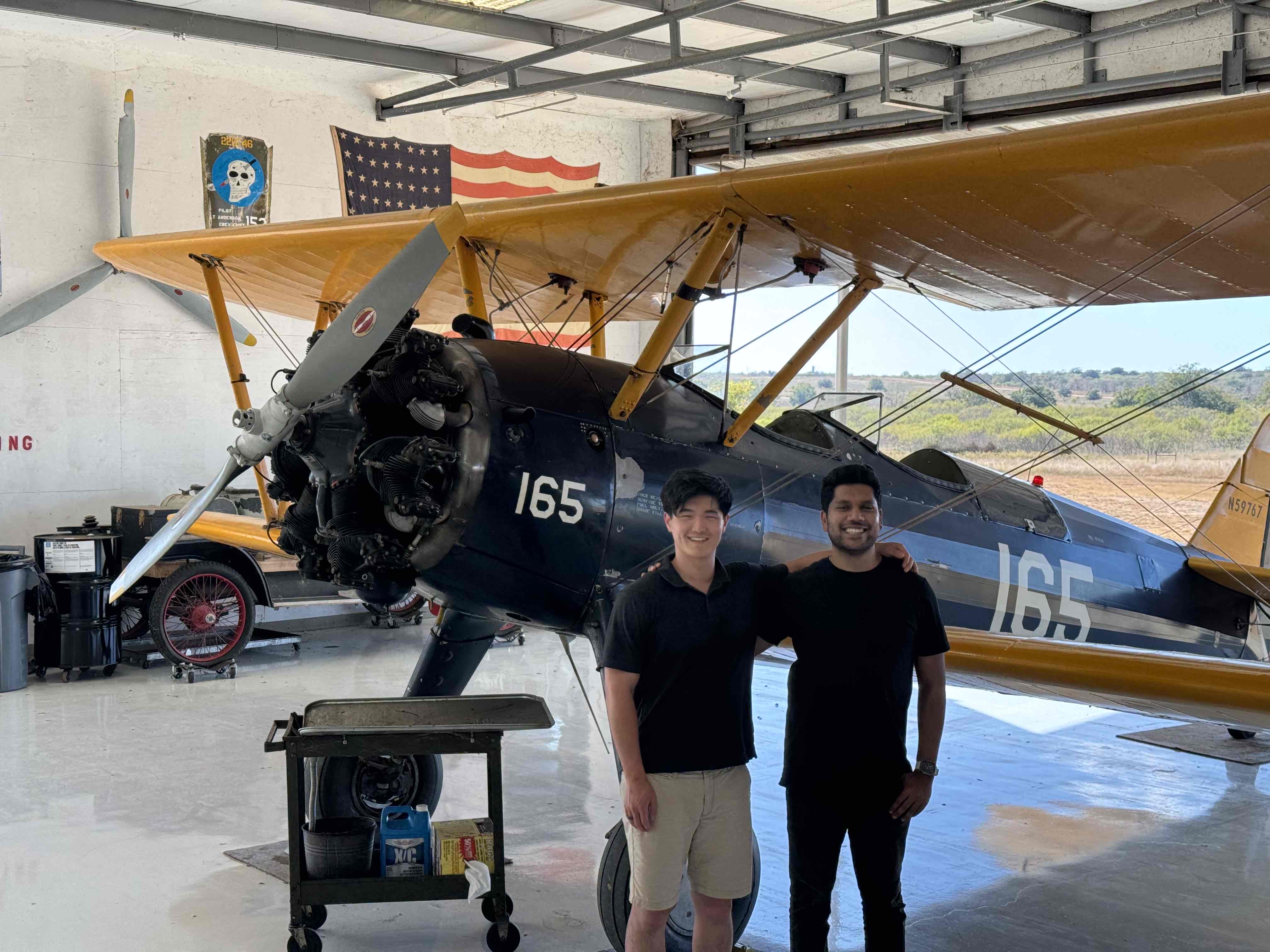 Vintage Navy Stearman aircraft in hangar