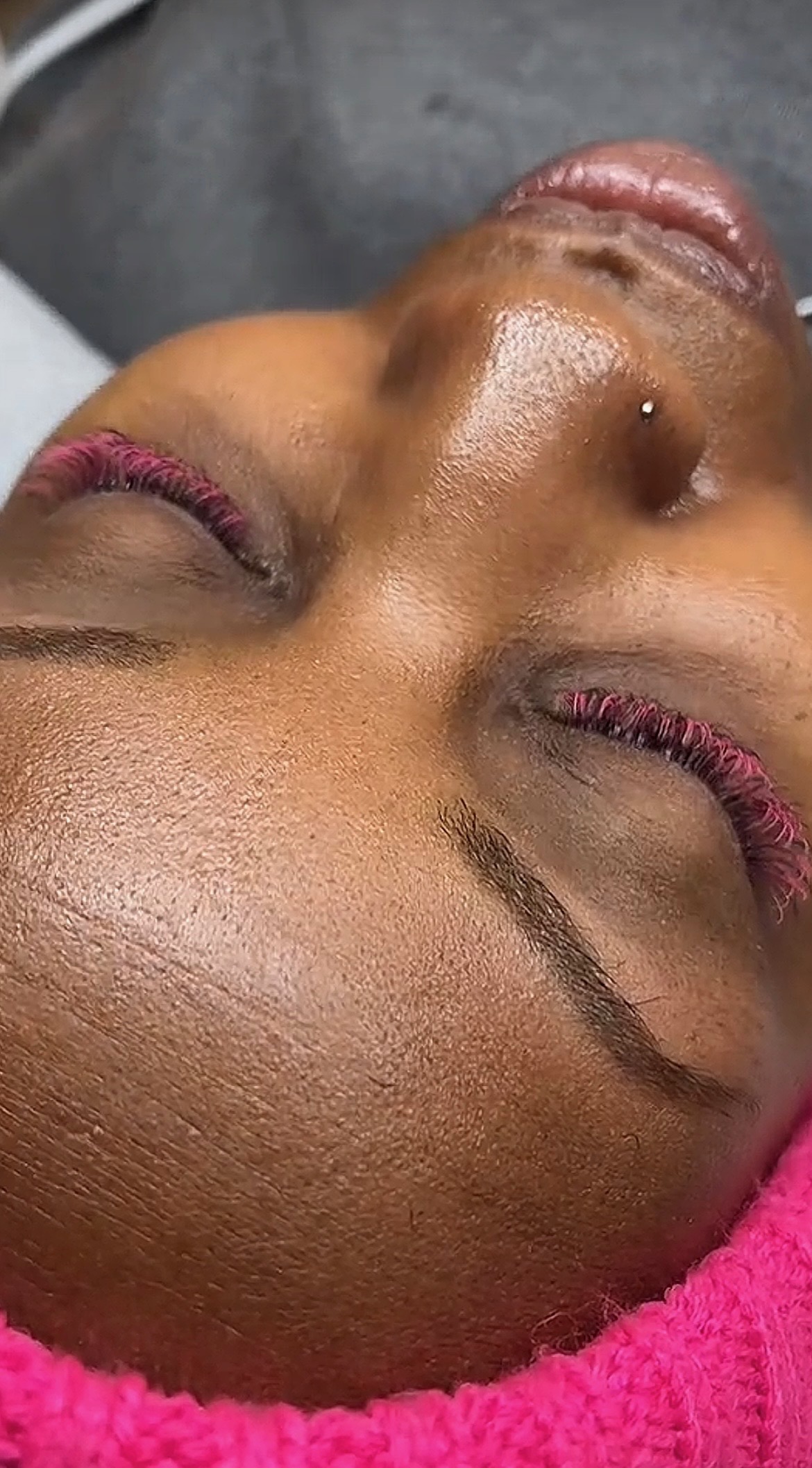 Fluffy pink colored lash extensions