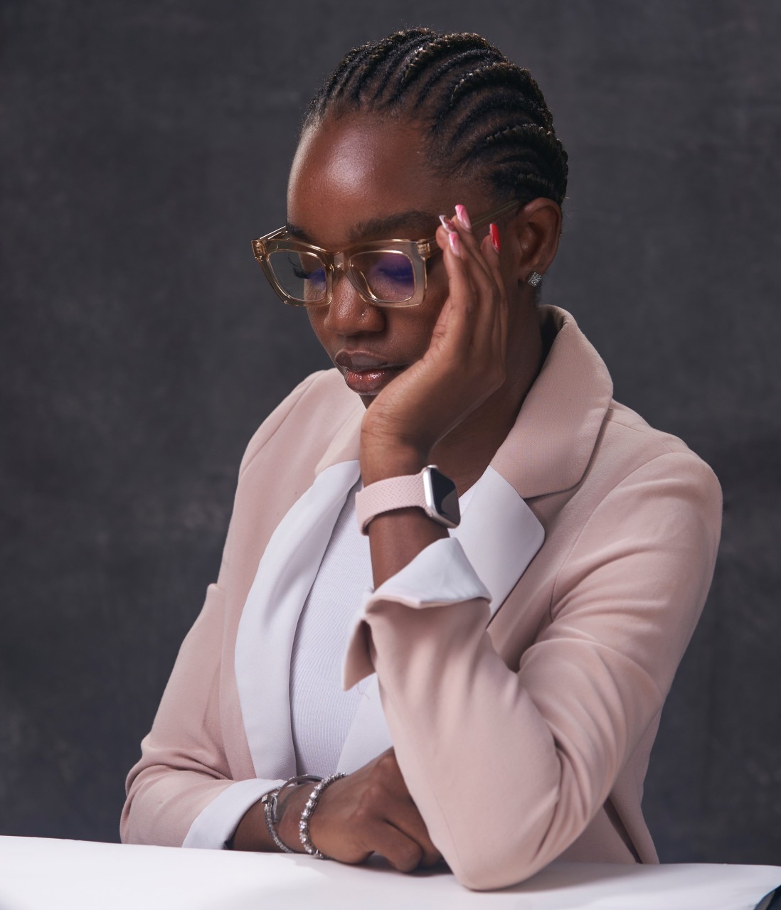 Suliat in a blush blazer