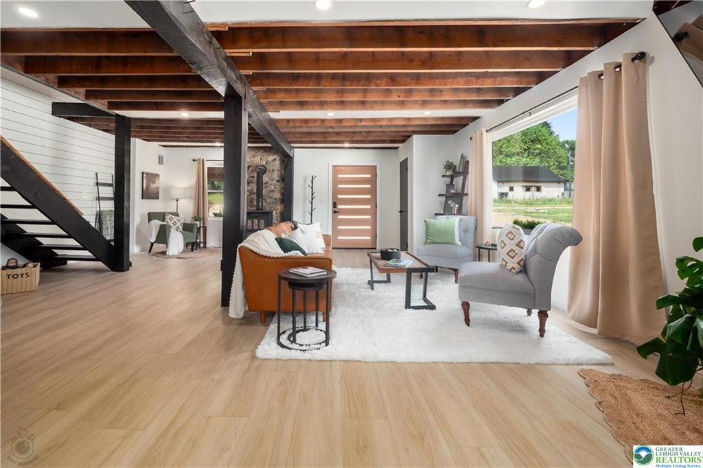 Warm, light wood-look flooring installed in a spacious open-plan living room