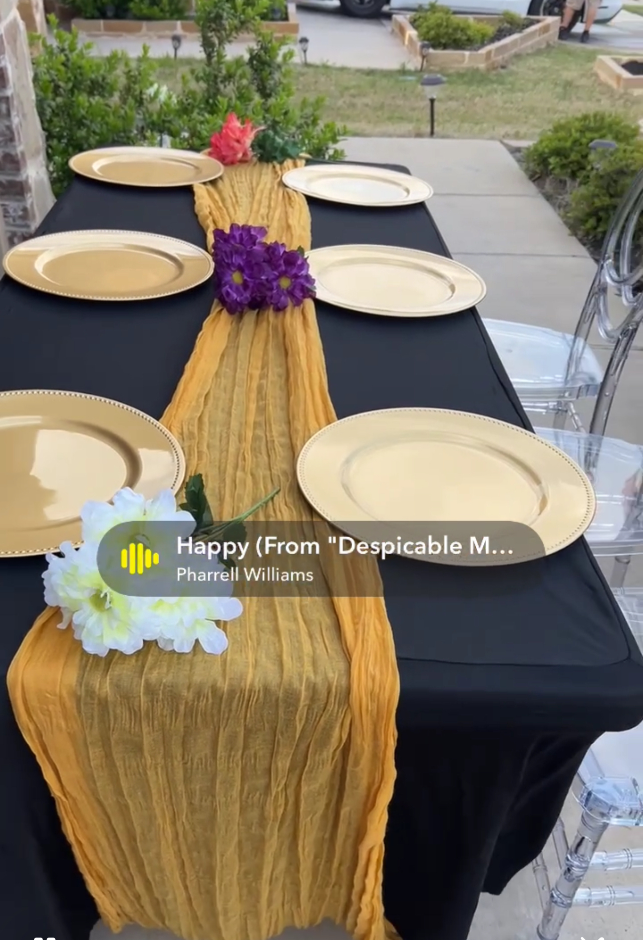 Acrylic chairs with gold table runner setup