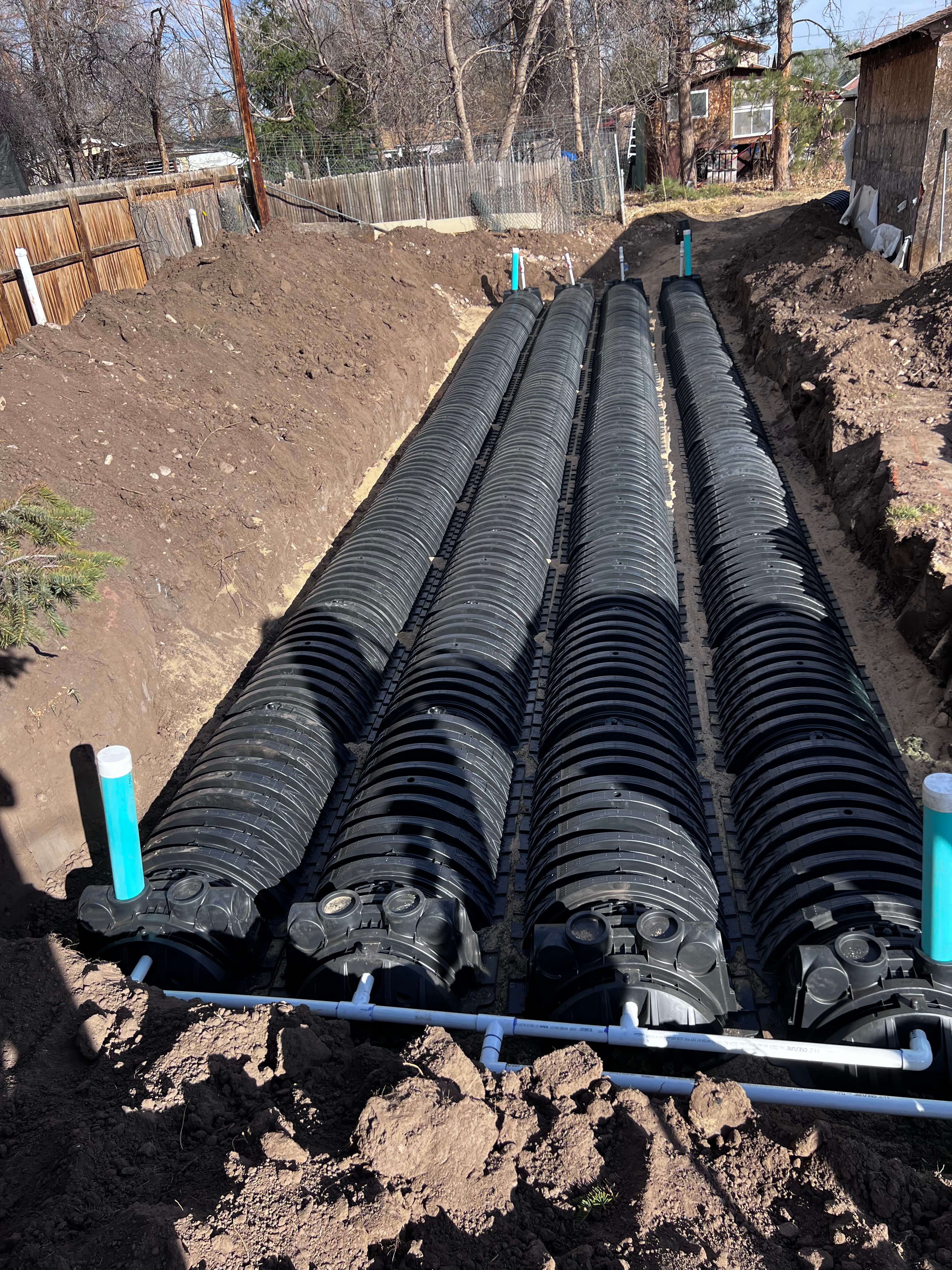 Four rows of infiltrator chambers with distribution piping