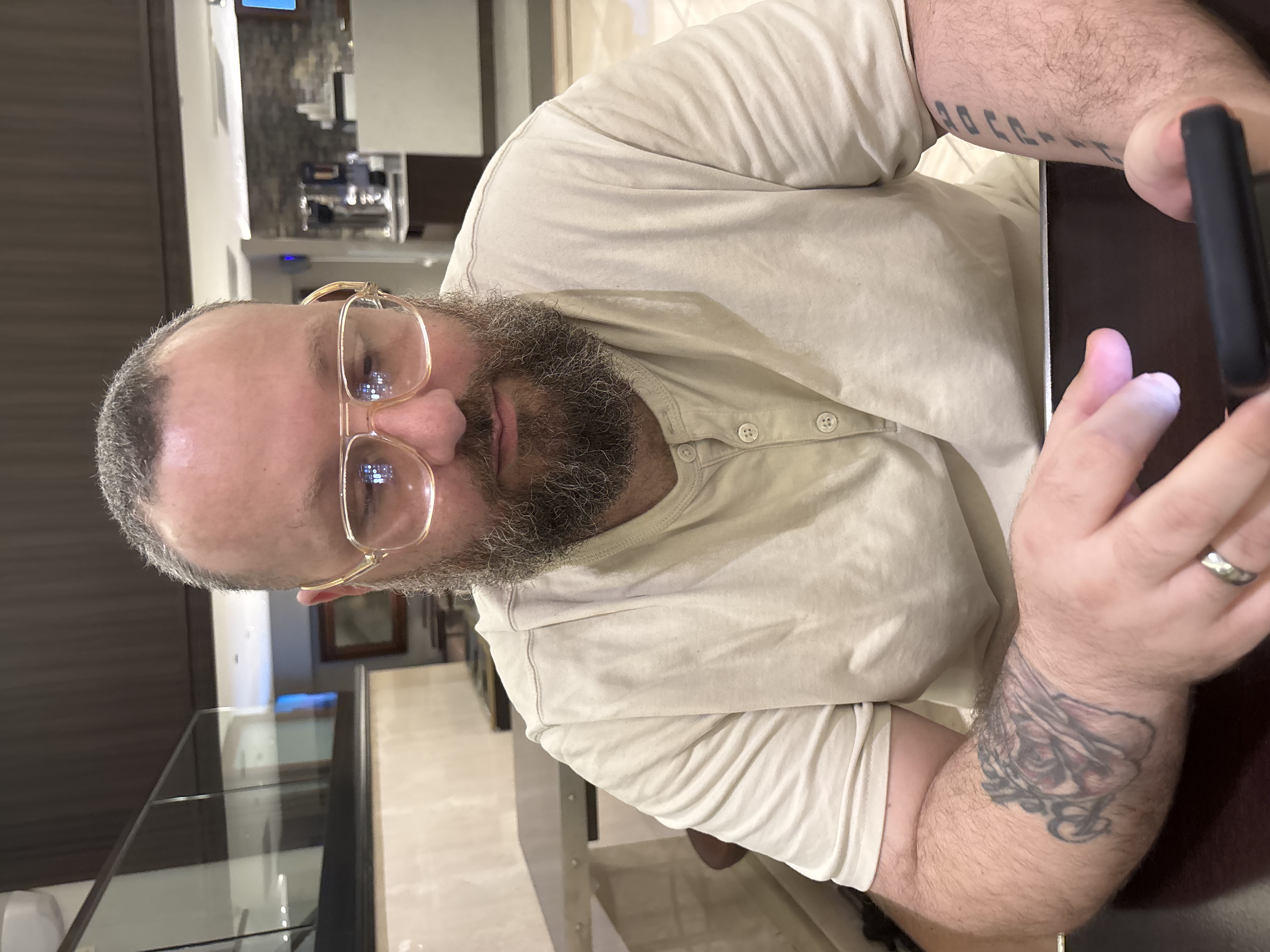 Photo of David Chikvashvili looking at phone