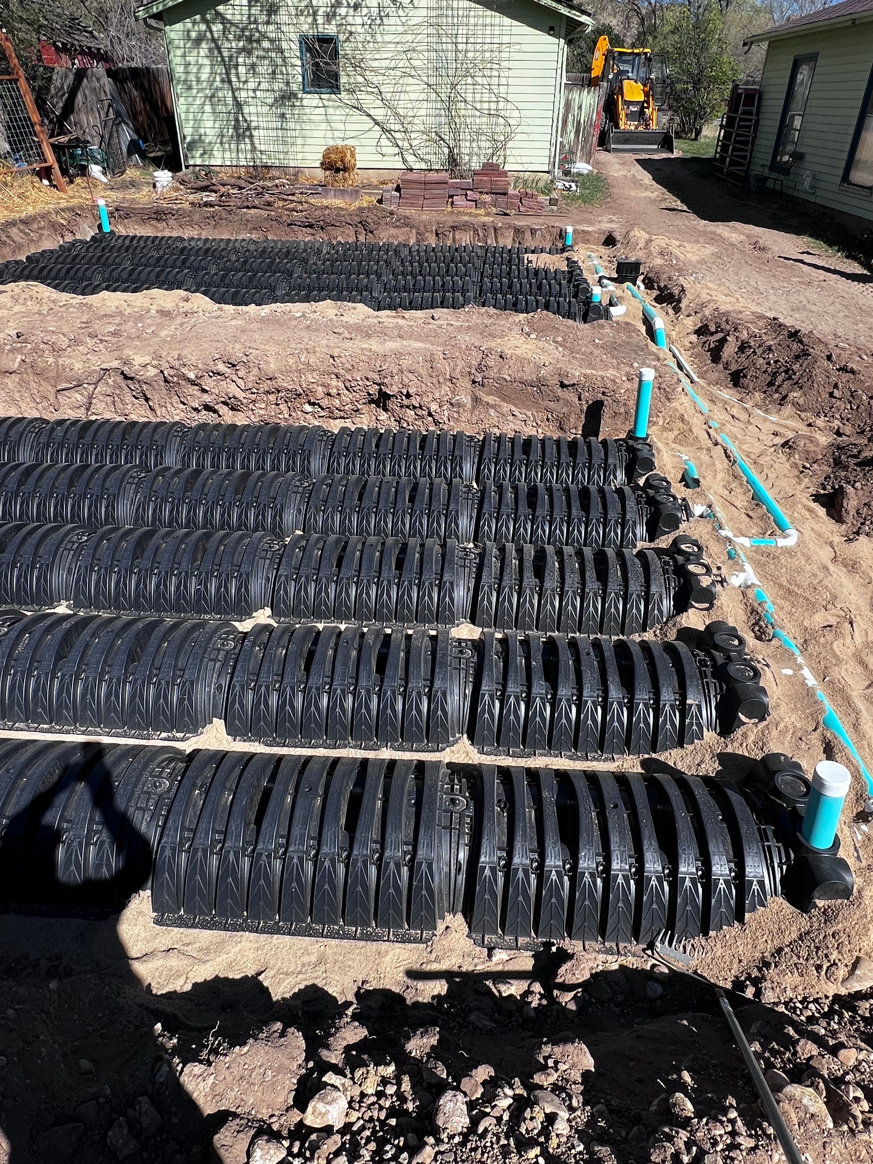Large infiltrator chamber leach field system with excavator