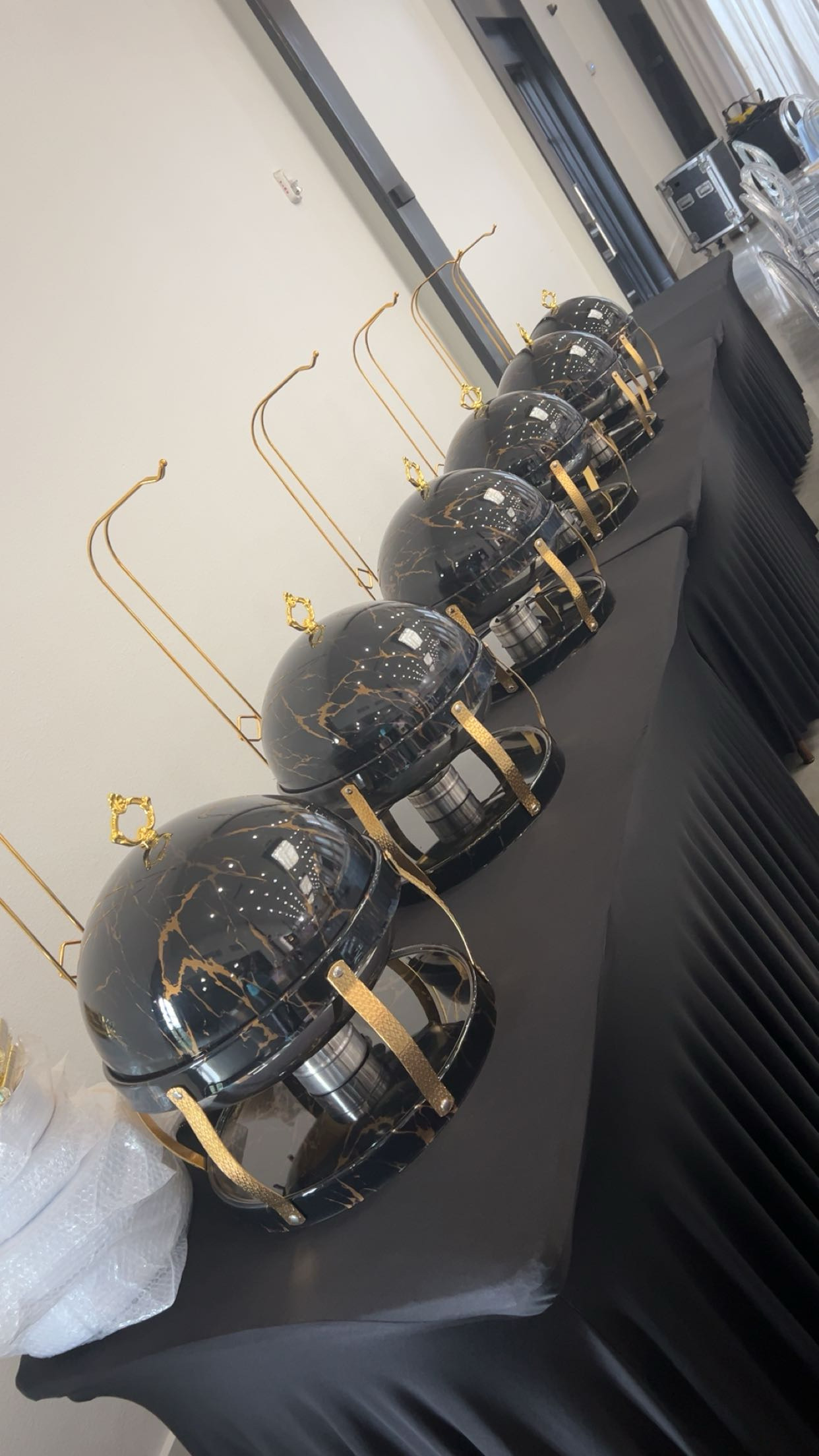 Elegant black chafing dishes with gold accents