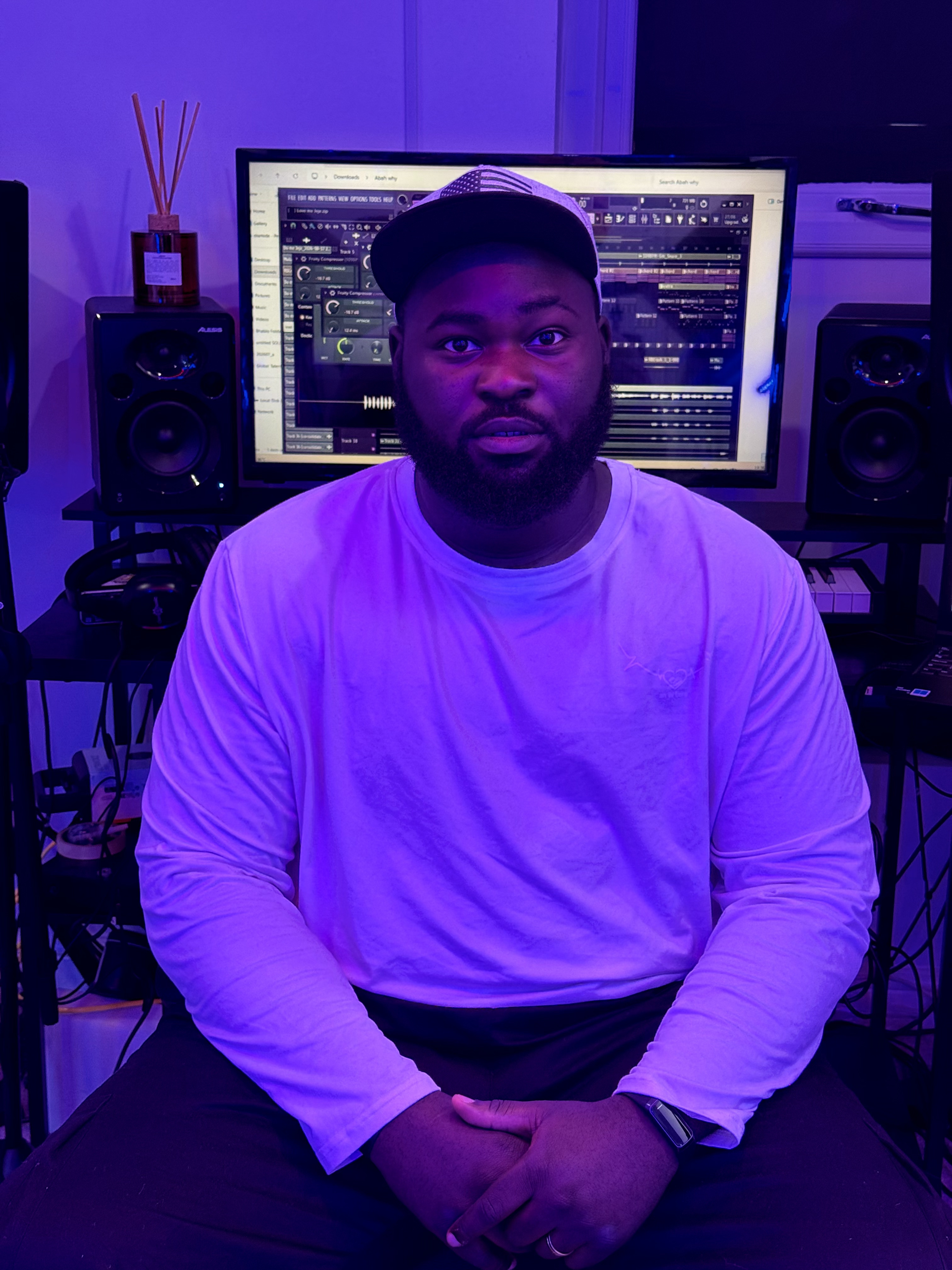 Bhablo seated in his recording studio beside the mixing desk