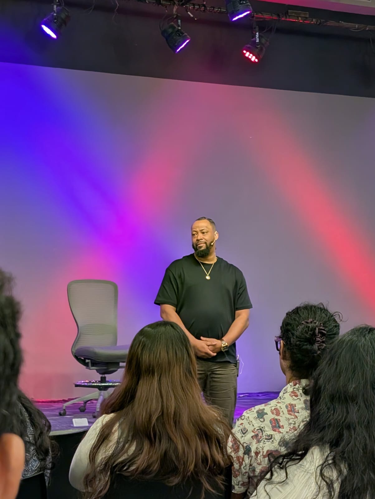 Wesley Fluellen on stage speaking to audience