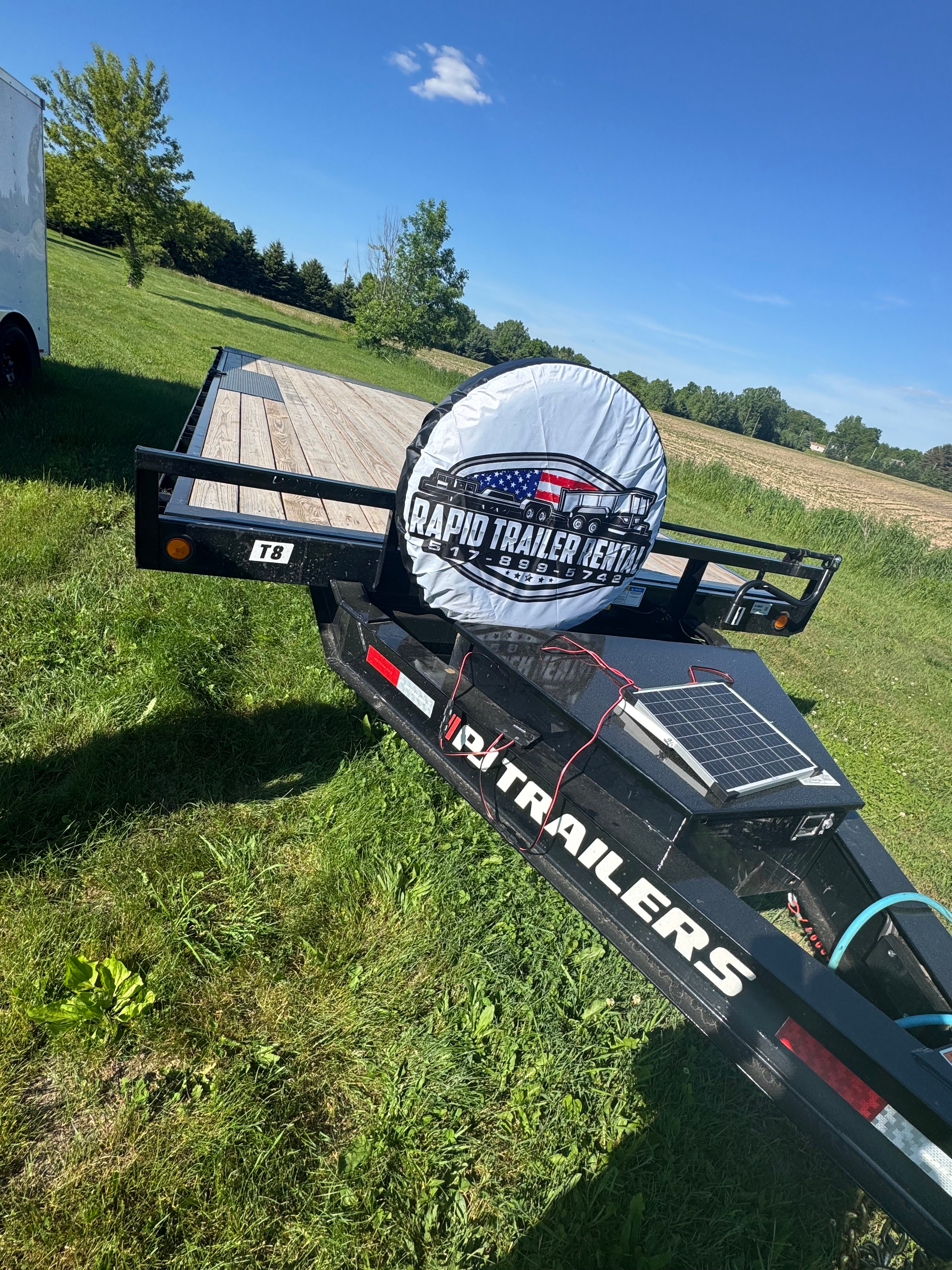 22ft PJ deckover tilt trailer for rent in Eaton Rapids MI — heavy equipment and forklift hauling
