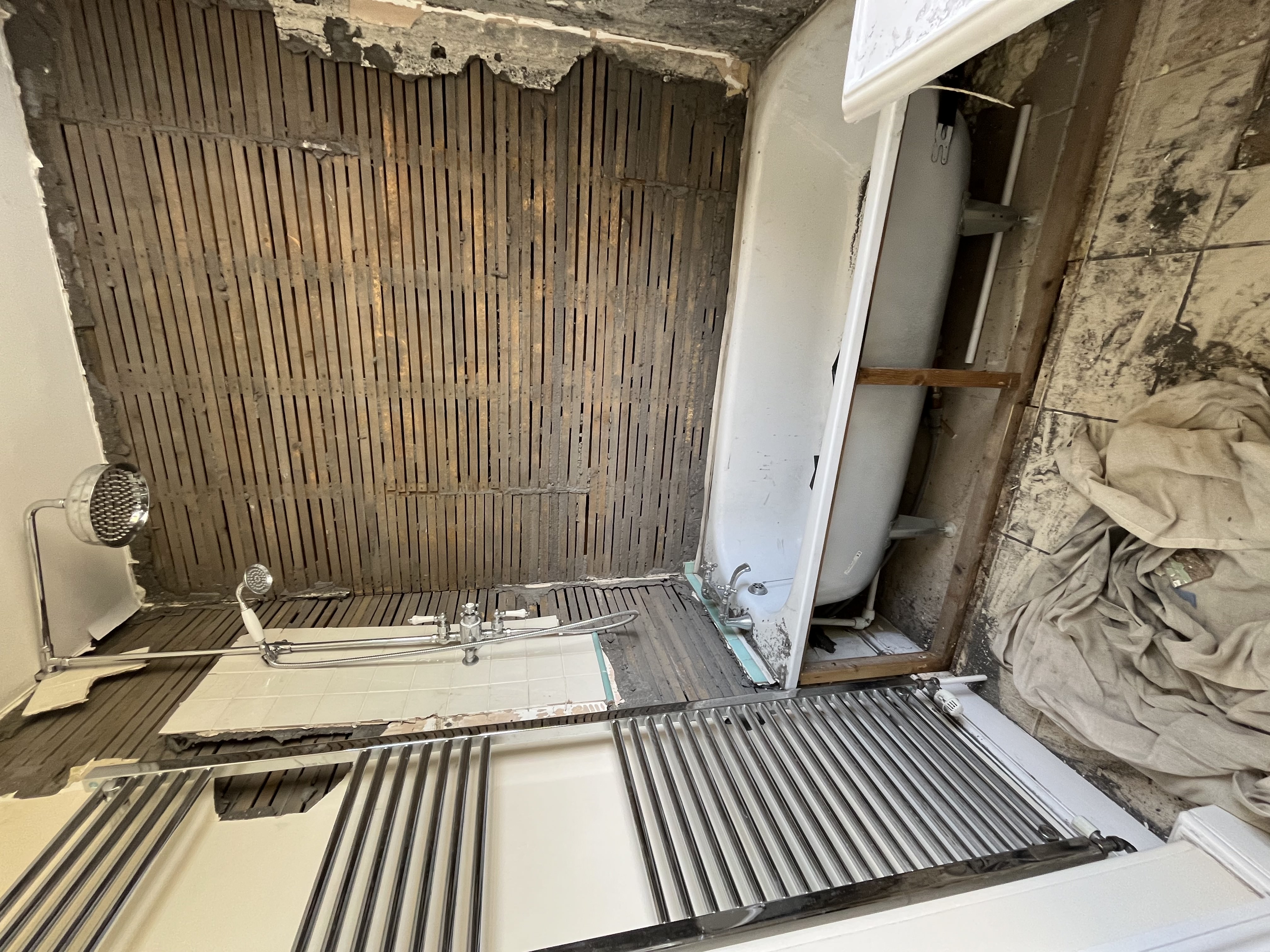 Strip out showing exposed lath and plaster