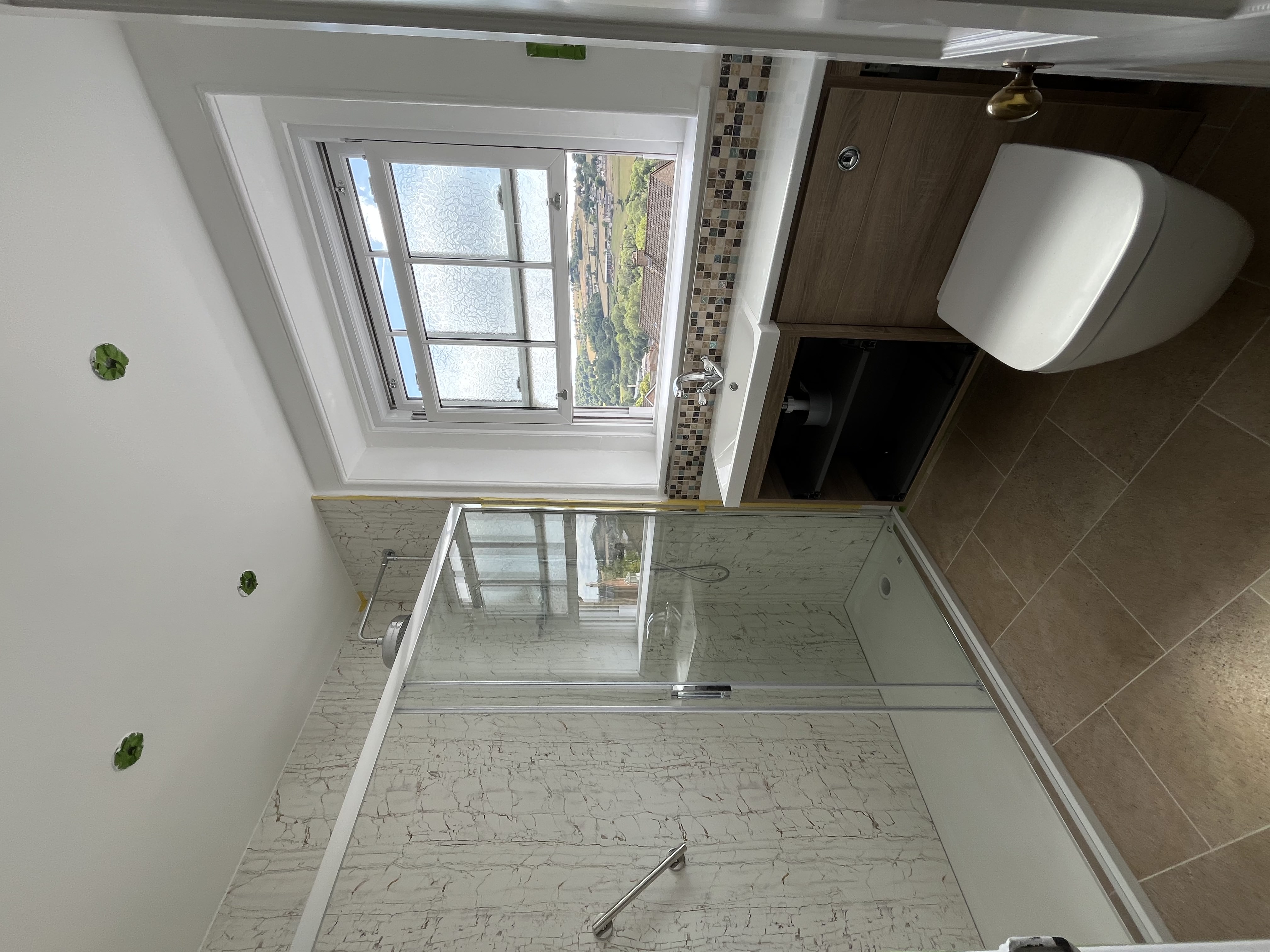 Completed bathroom with walk-in shower and valley views