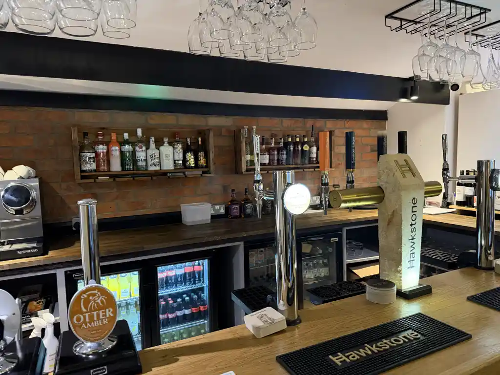 Bar front with pumps and spirits shelf