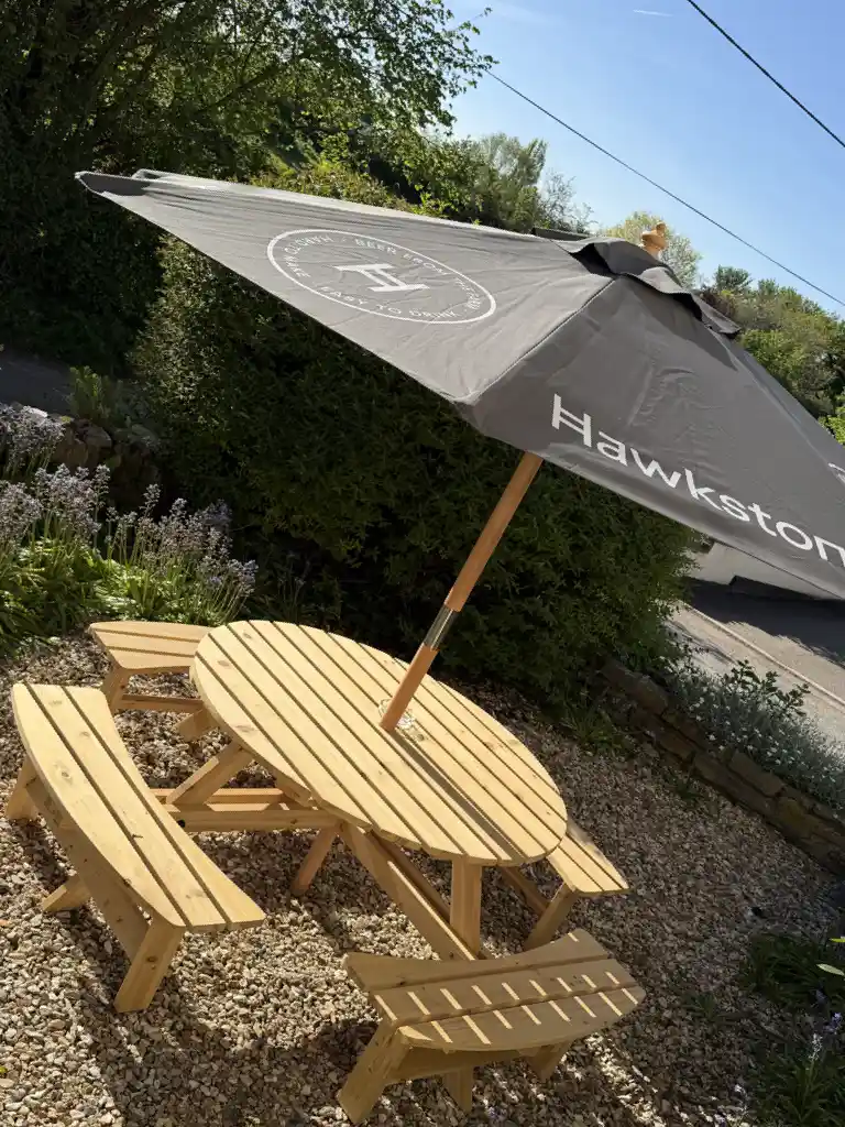 Beer garden round table with Hawkstone parasol