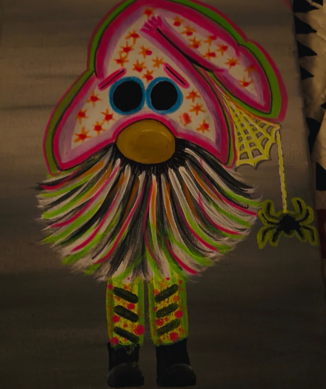 Unlit hand-painted Halloween gnome with a colorful hat and striped legs