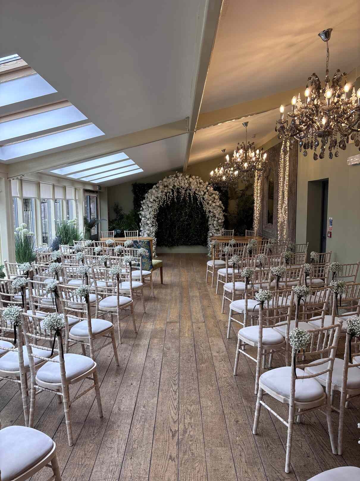 White floral arch wedding ceremony setup Hull