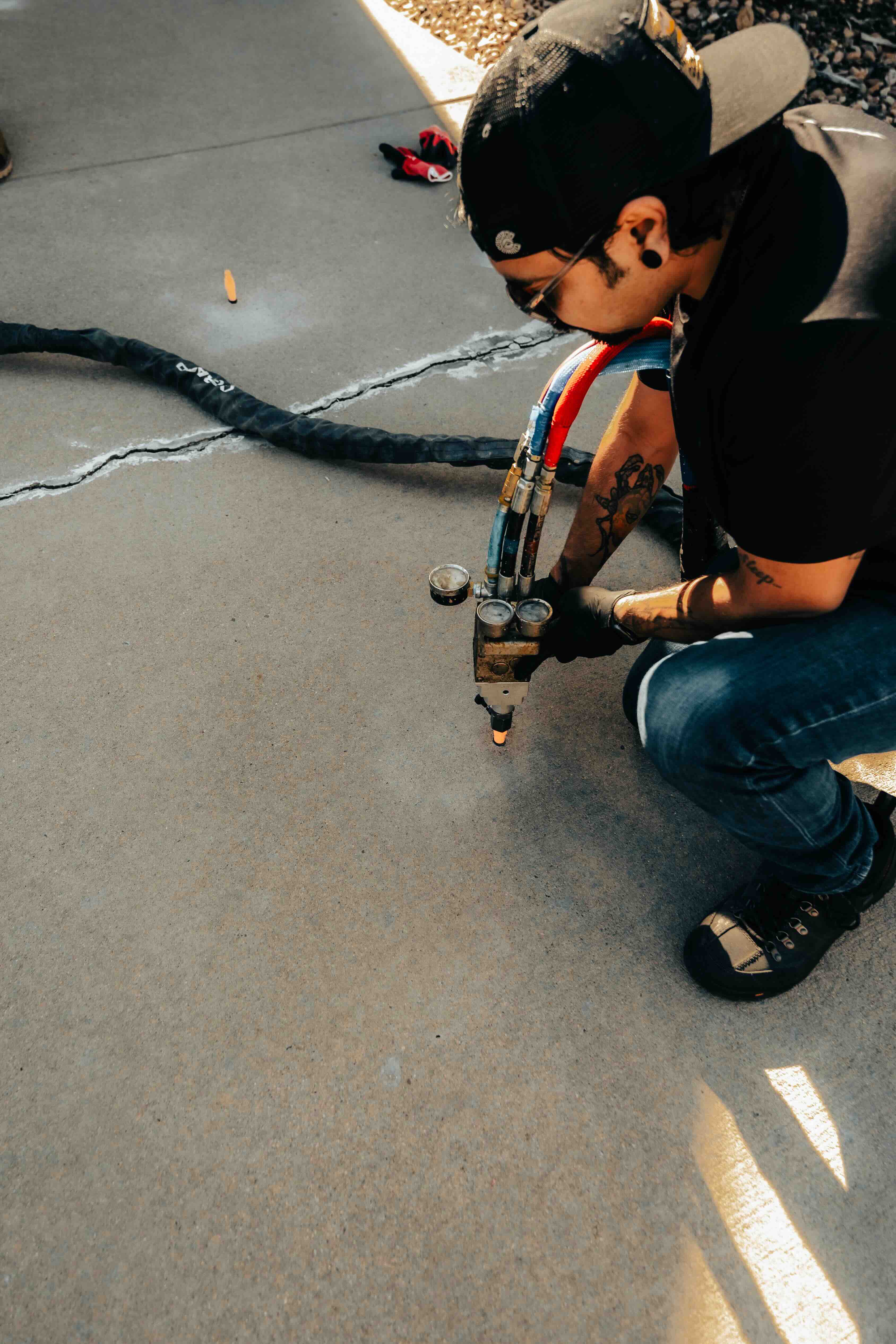 Contractor social media content - window tinting professional at work in commercial building