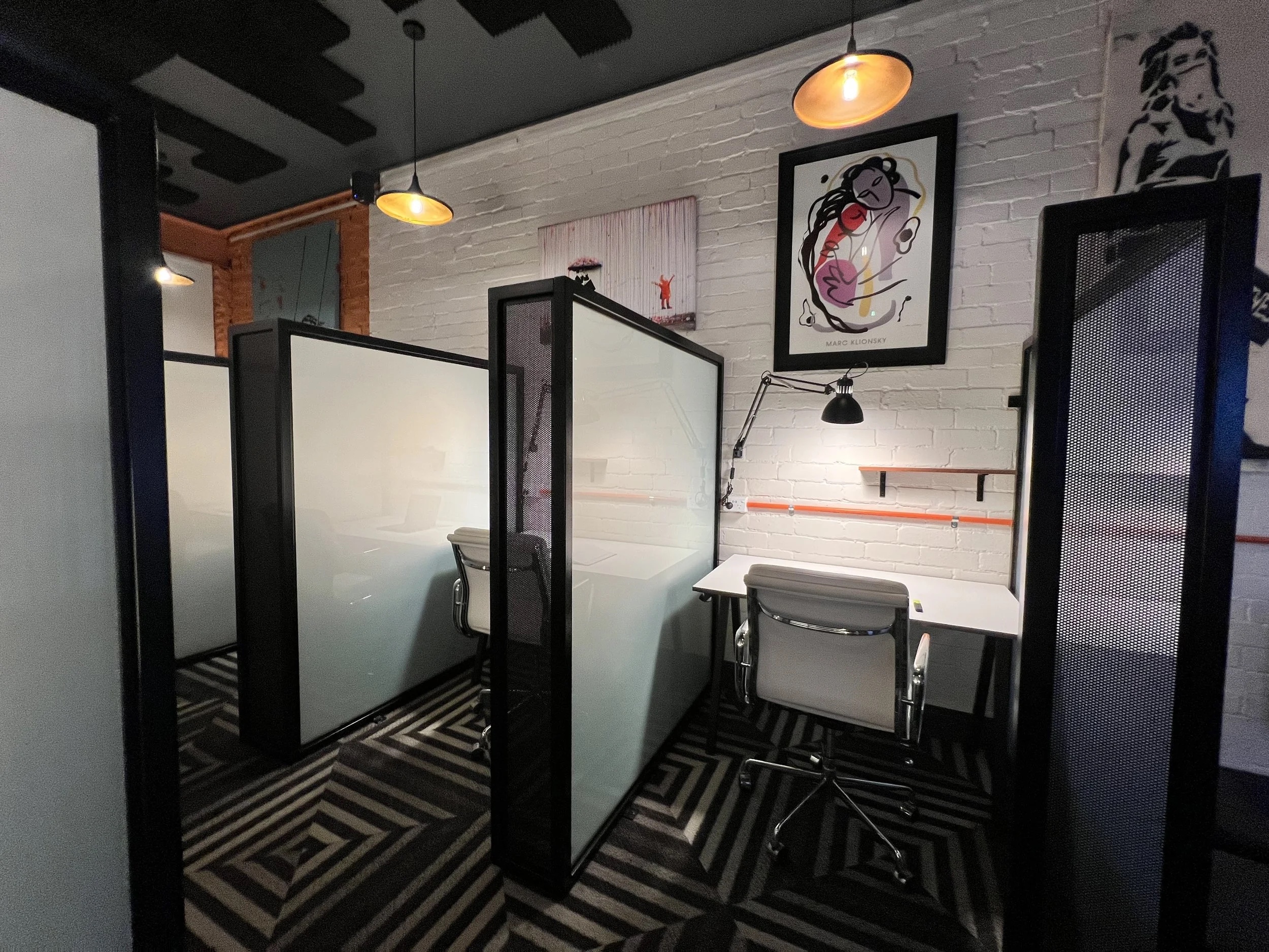 Work pods with frosted glass partitions