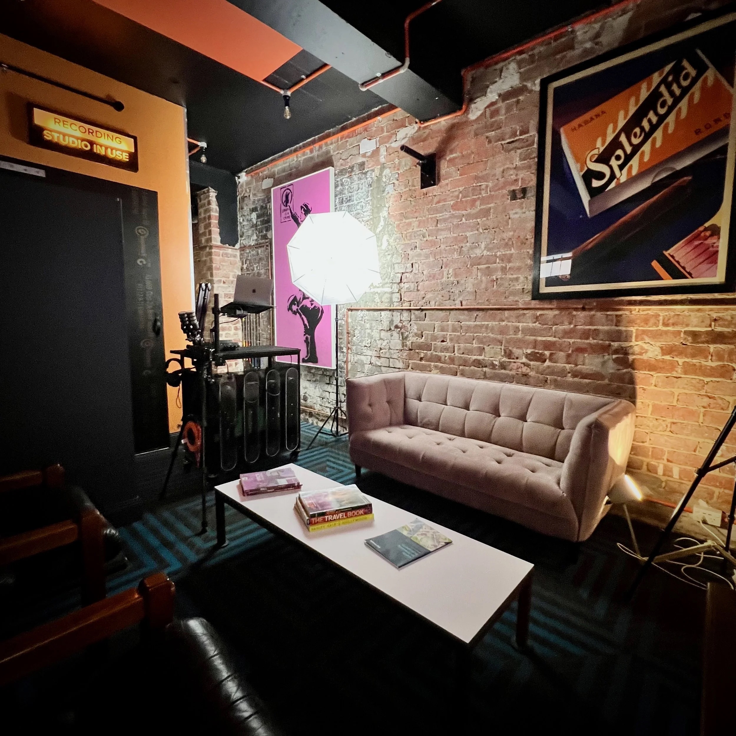 Lounge area with vintage poster and lighting