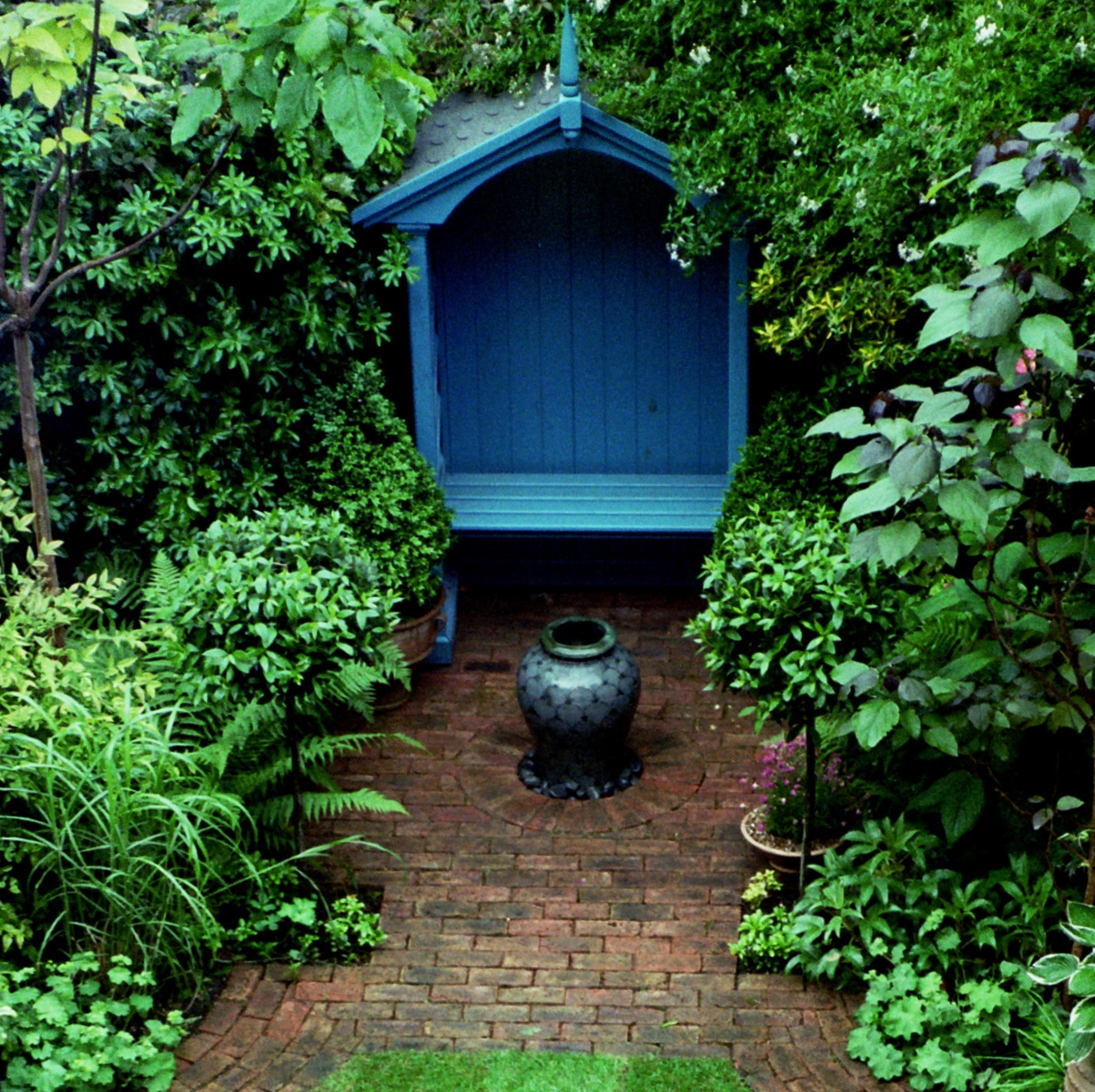 Garden seating and patio area with planted borders