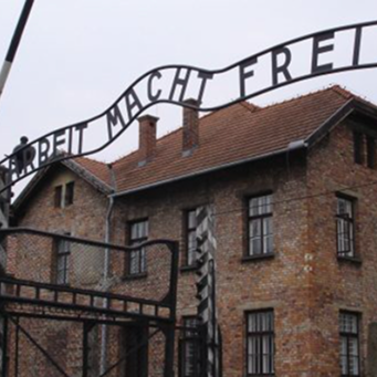 Entrance gate to Auschwitz concentration camp with the words 'Arbeit Macht Frei'