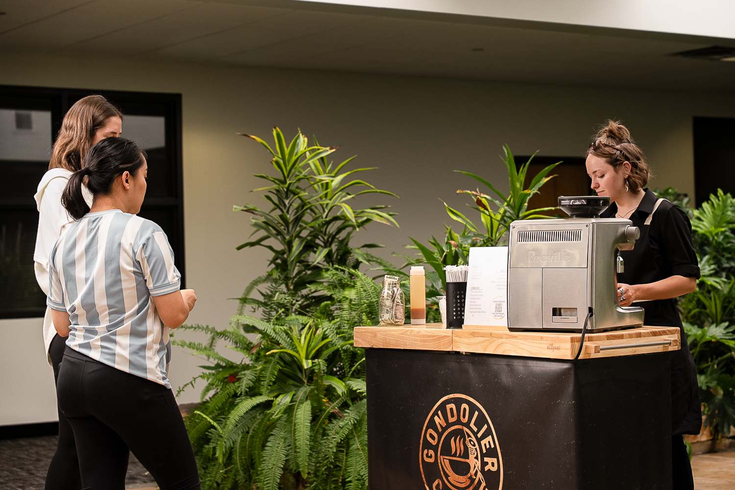 Customer being served at Gondolier Coffee mobile cart